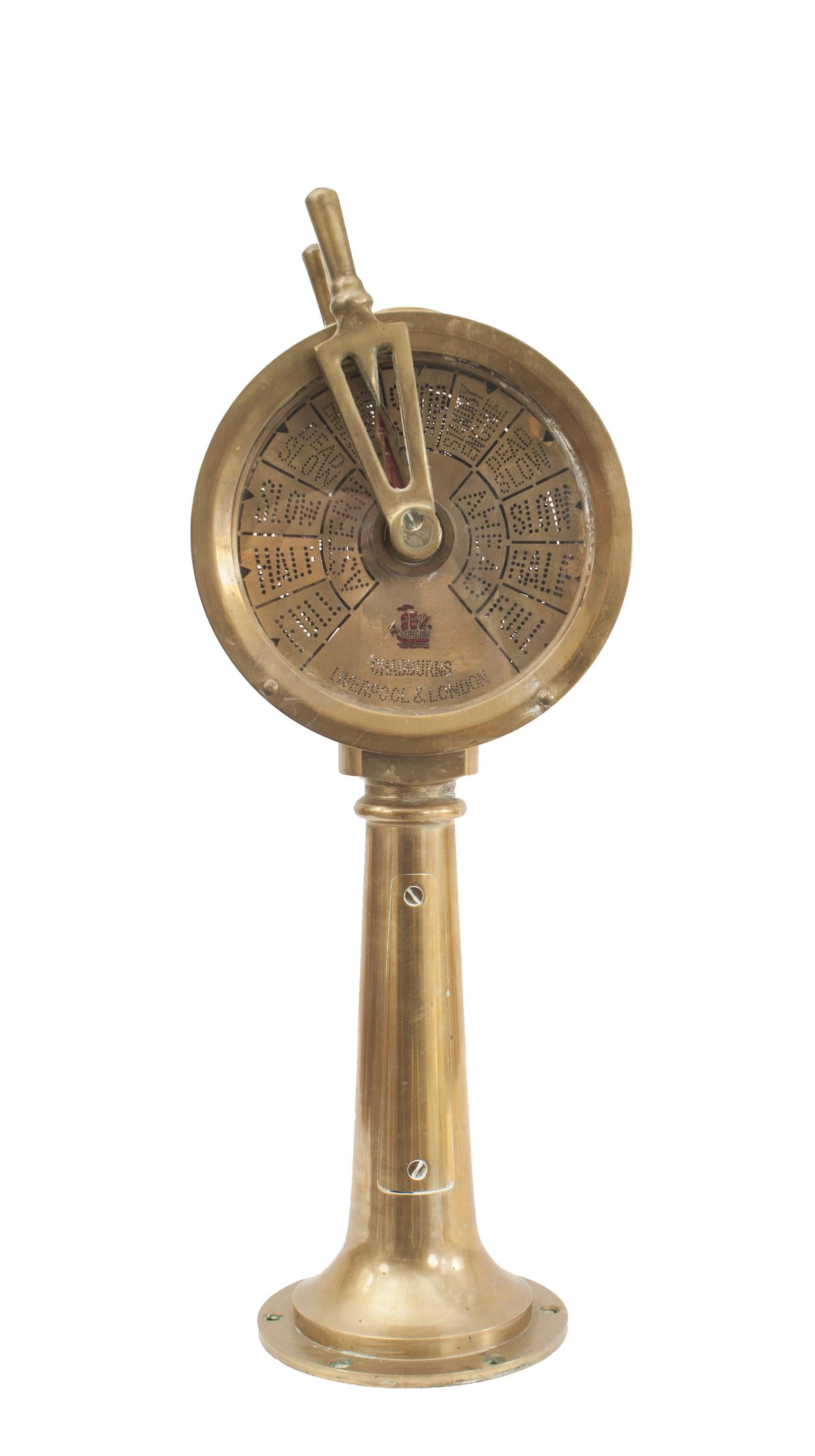 Small brass ship's engine telegraph with movable arm and working chime.
 