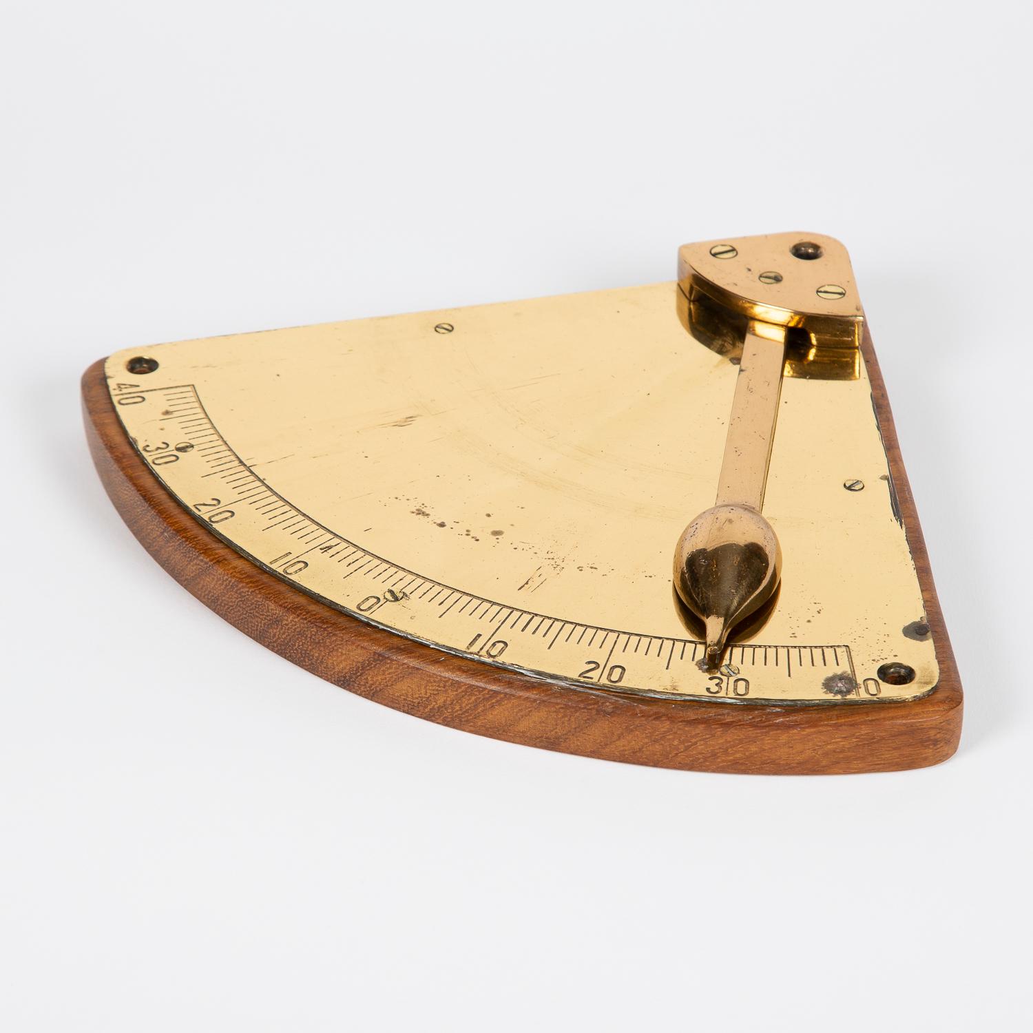 A brass ship's inclinometer, circa 1910.

Scale in degrees from the vertical to 40° of tilt/list.

An inclinometer, or clinometer, is an instrument used for measuring angles of slope (or tilt) or elevation of an object with respect to gravity's