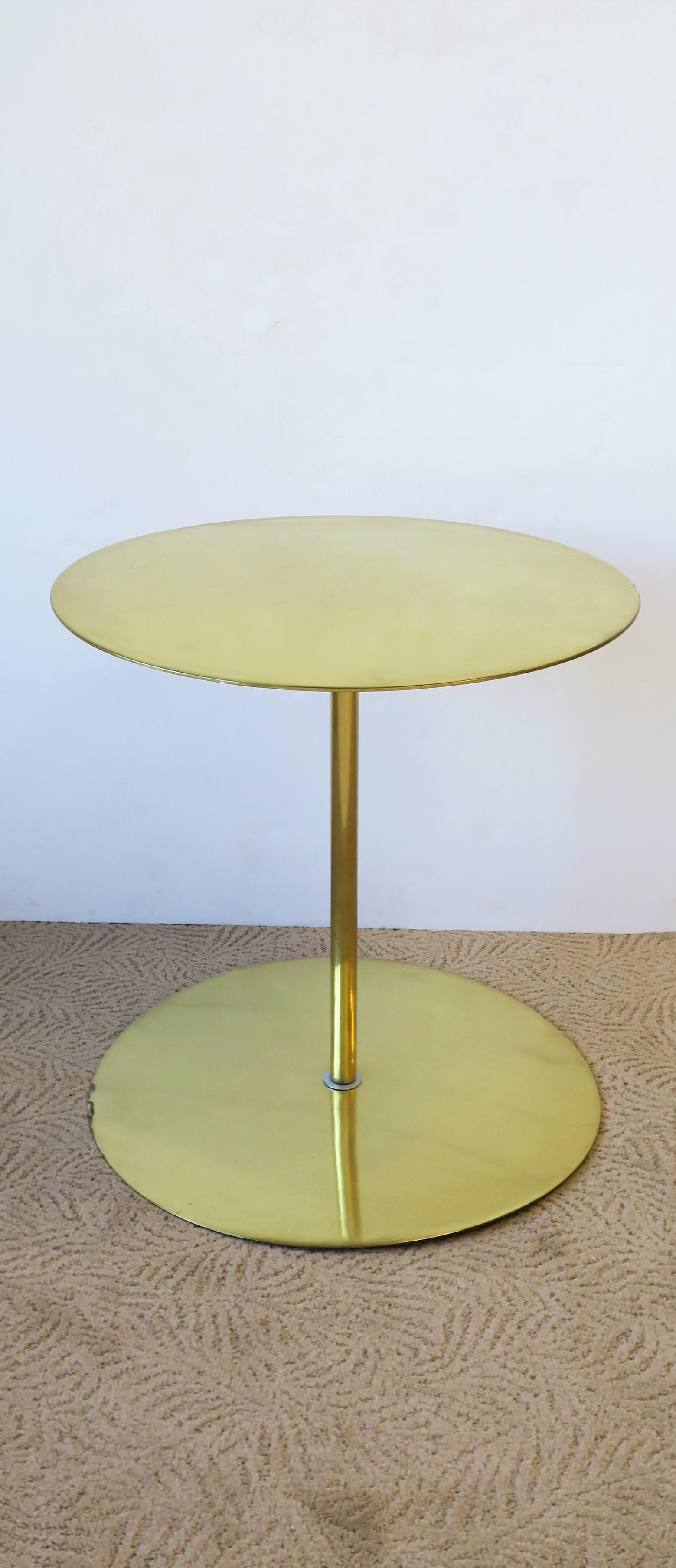 A substantial and sleek modern style contemporary solid brass round side or drinks table. Dimensions: 19.63