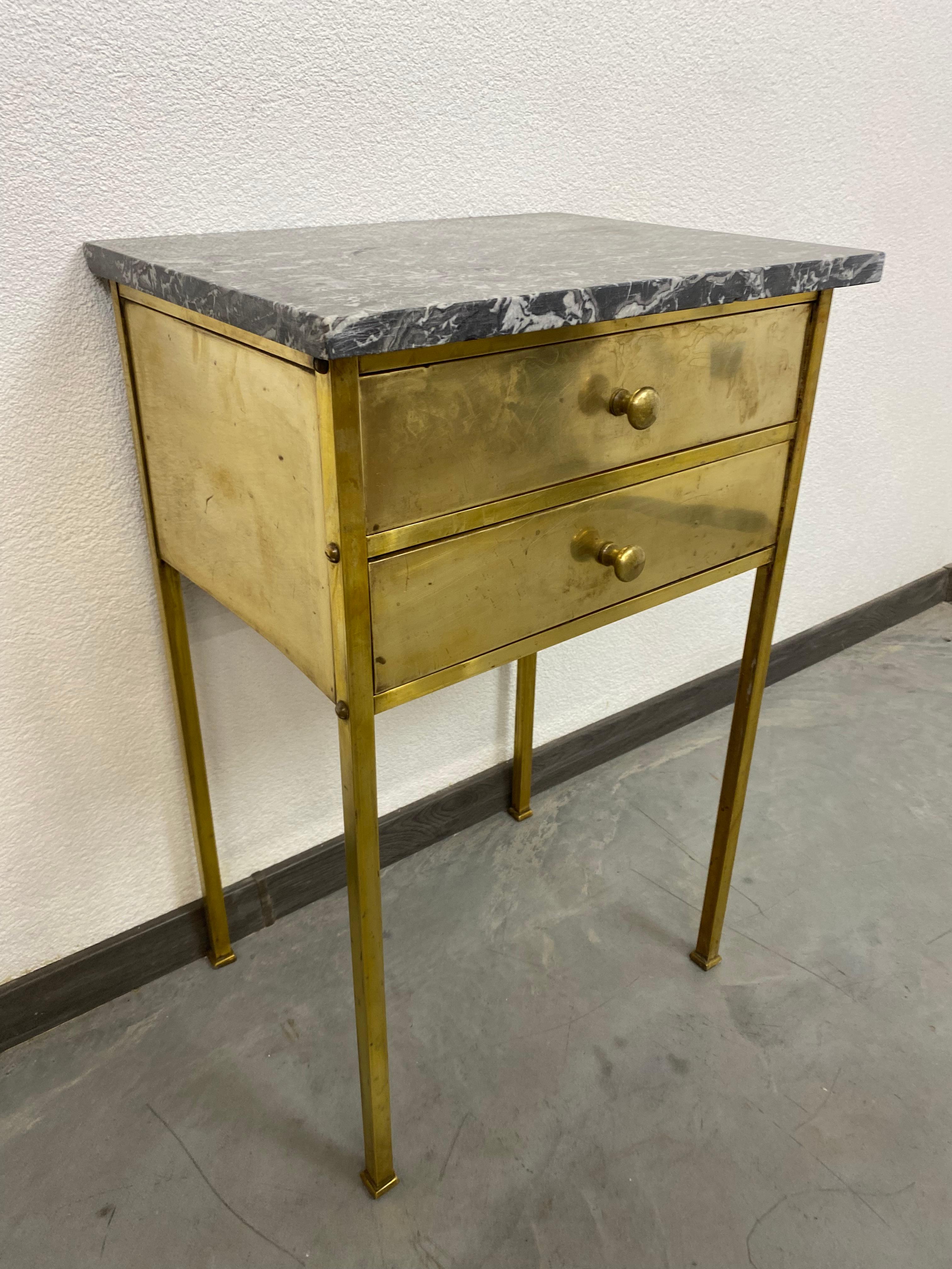 Brass side table with marble top.