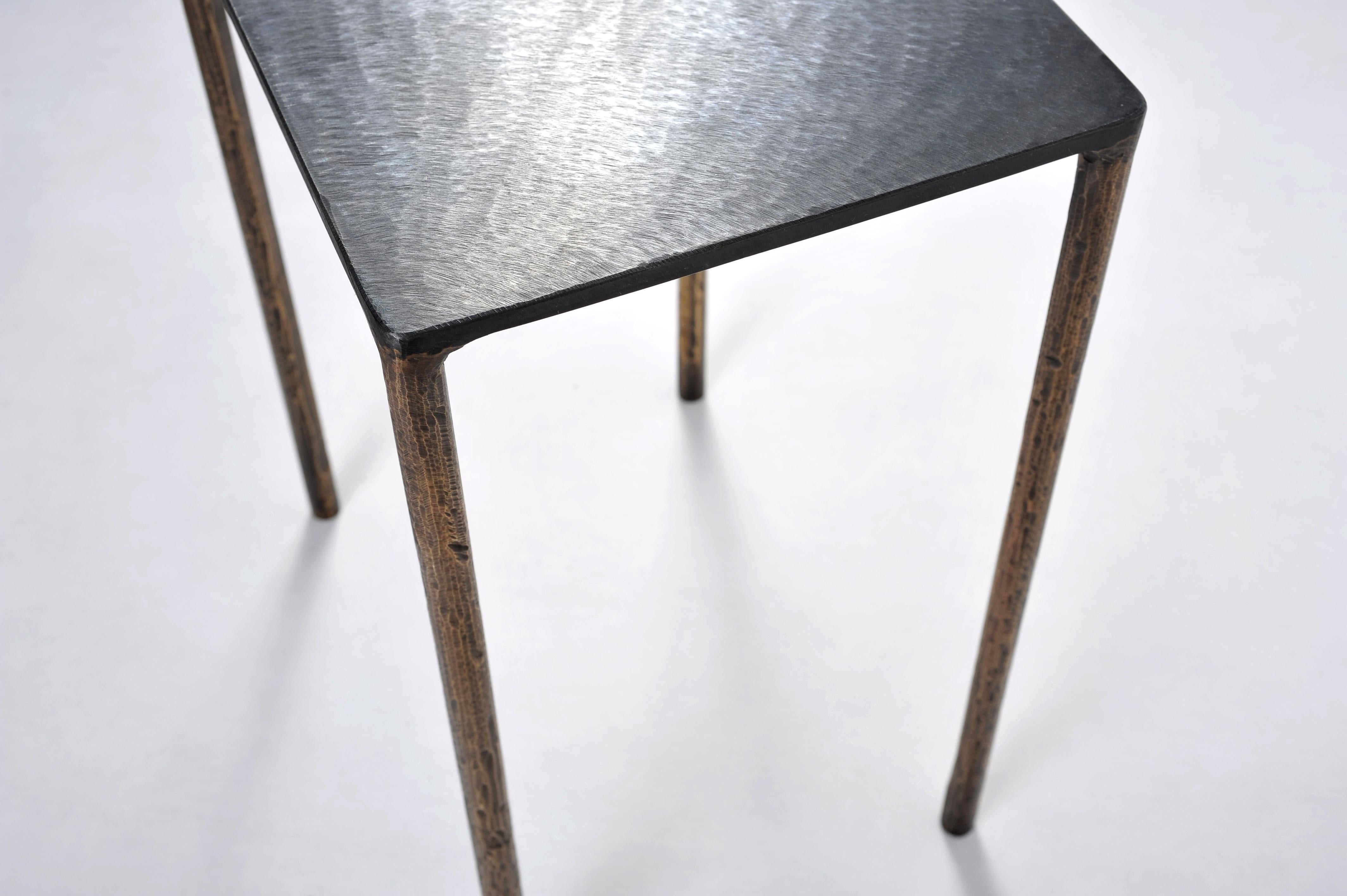Brass side table signed by Lukasz Friedrich.
Textured side or coffee table.
Materials: Legs: Legs, patinated brass; top, patinated and waxed steel.
Dimensions: D 28 cm, L 38 cm, H 50 cm.
Signed and dated.

Lukasz Friedrich (born 1980), lives