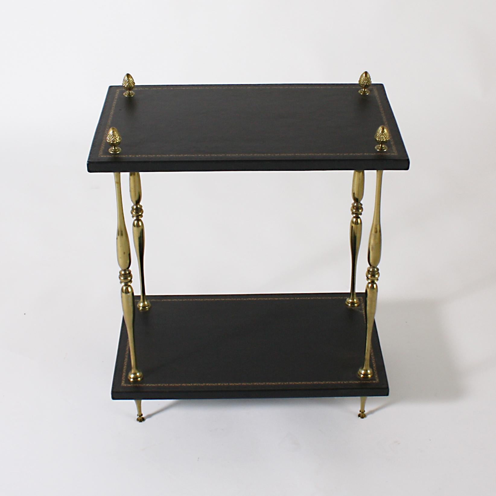 Brass side table with leather tops, circa 1950.