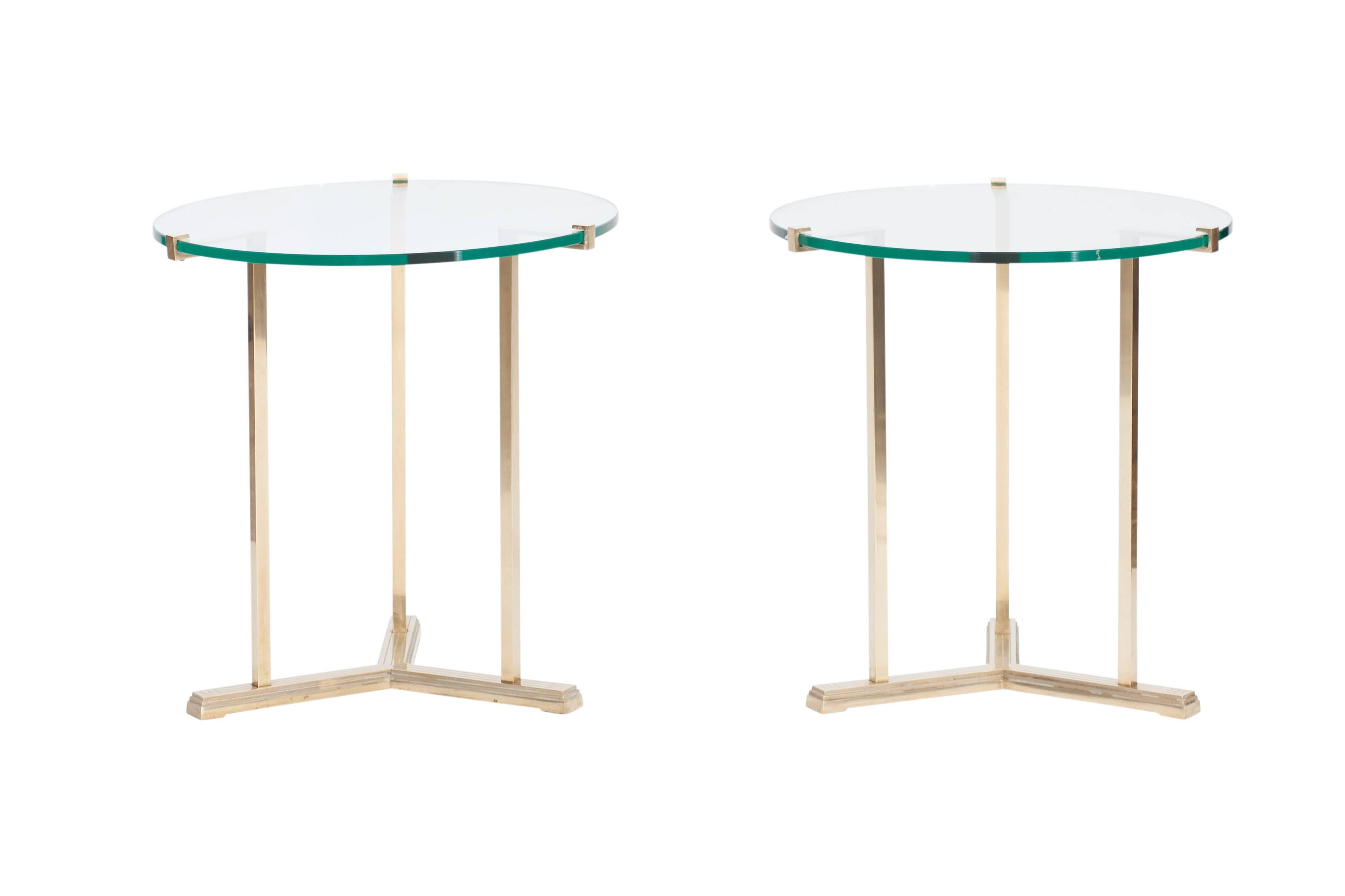 Hollywood Regency side tables by Peter Ghyczy.

Round clear glass top mounted in a brass frame.

Hollywood Regency Italian glam style.

Measures: H 63 cm, Ø 60 cm.