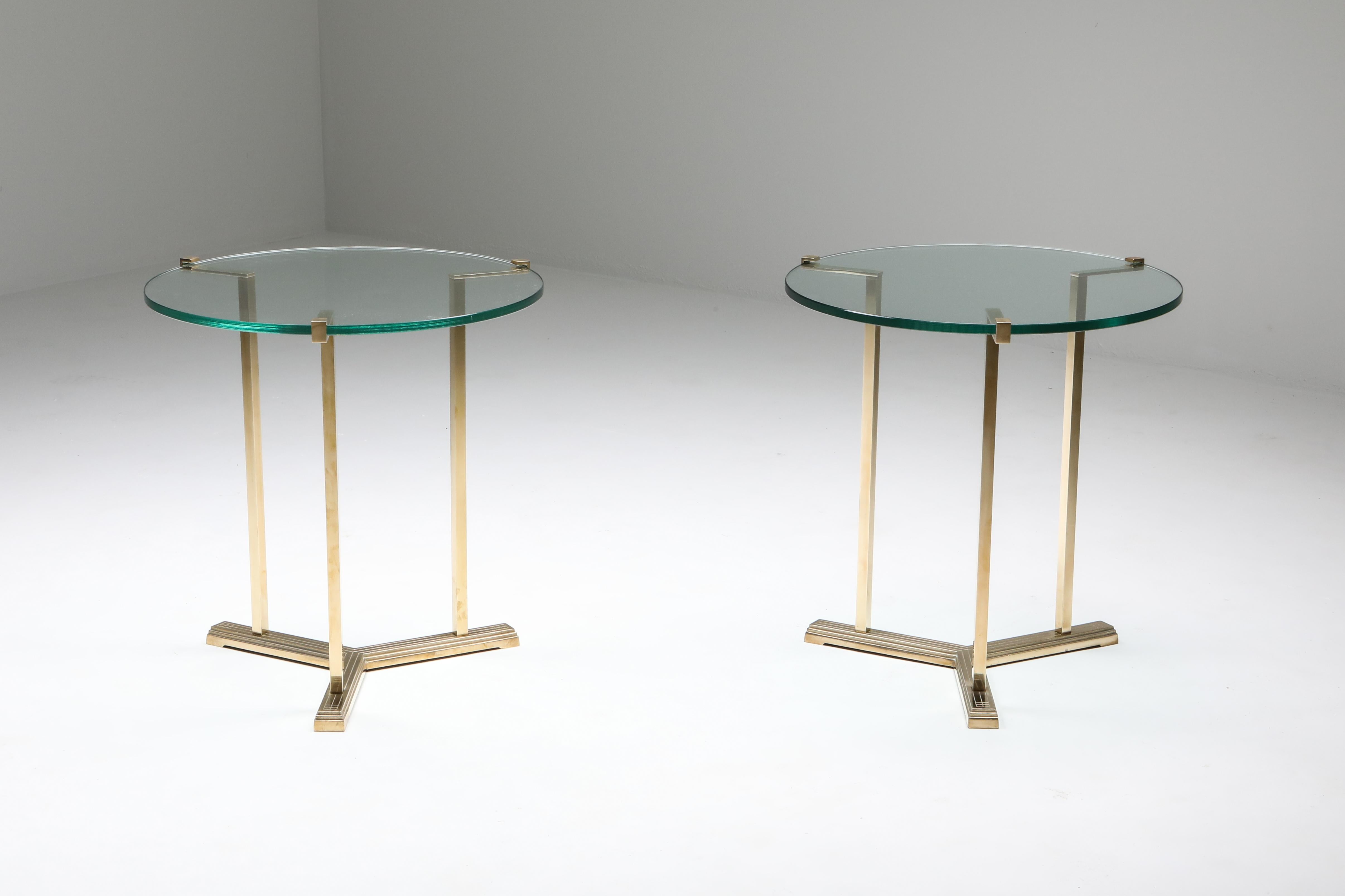 Hollywood Regency, pair of side tables, Peter Ghyczy, Netherlands, 1980s

Round clear glass top mounted in a brass cast frame.
Due to their height these can also be used as a pedestal or occasional table
Measures: H 63 cm, Ø 60 cm.
   