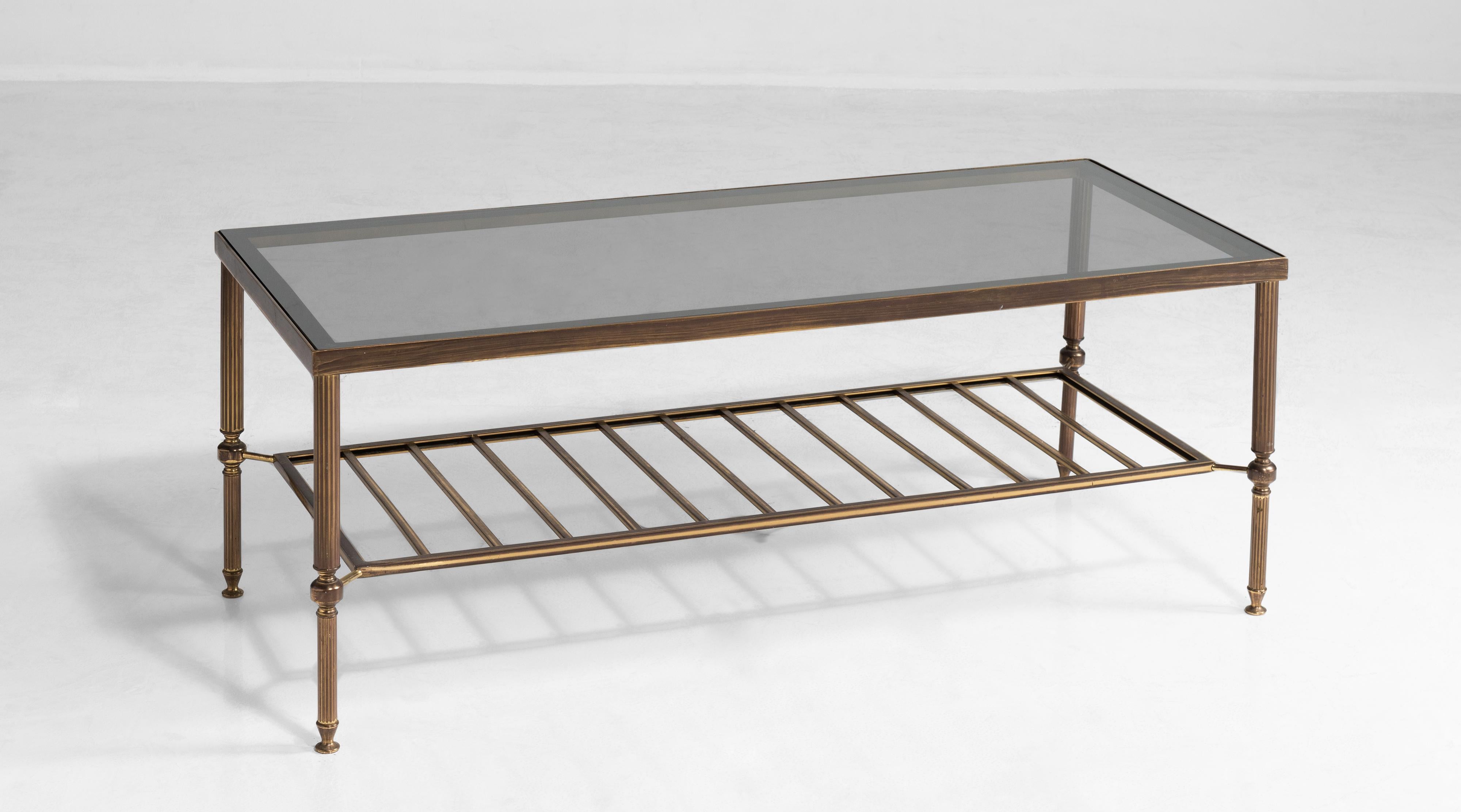 Brass and smoked glass coffee table, France, circa 1950.

Brass frame with original Rankin Royal smoked glass top. Rankin Royal has been manufacturing glass in France since 1830 and hold the royal warrant.