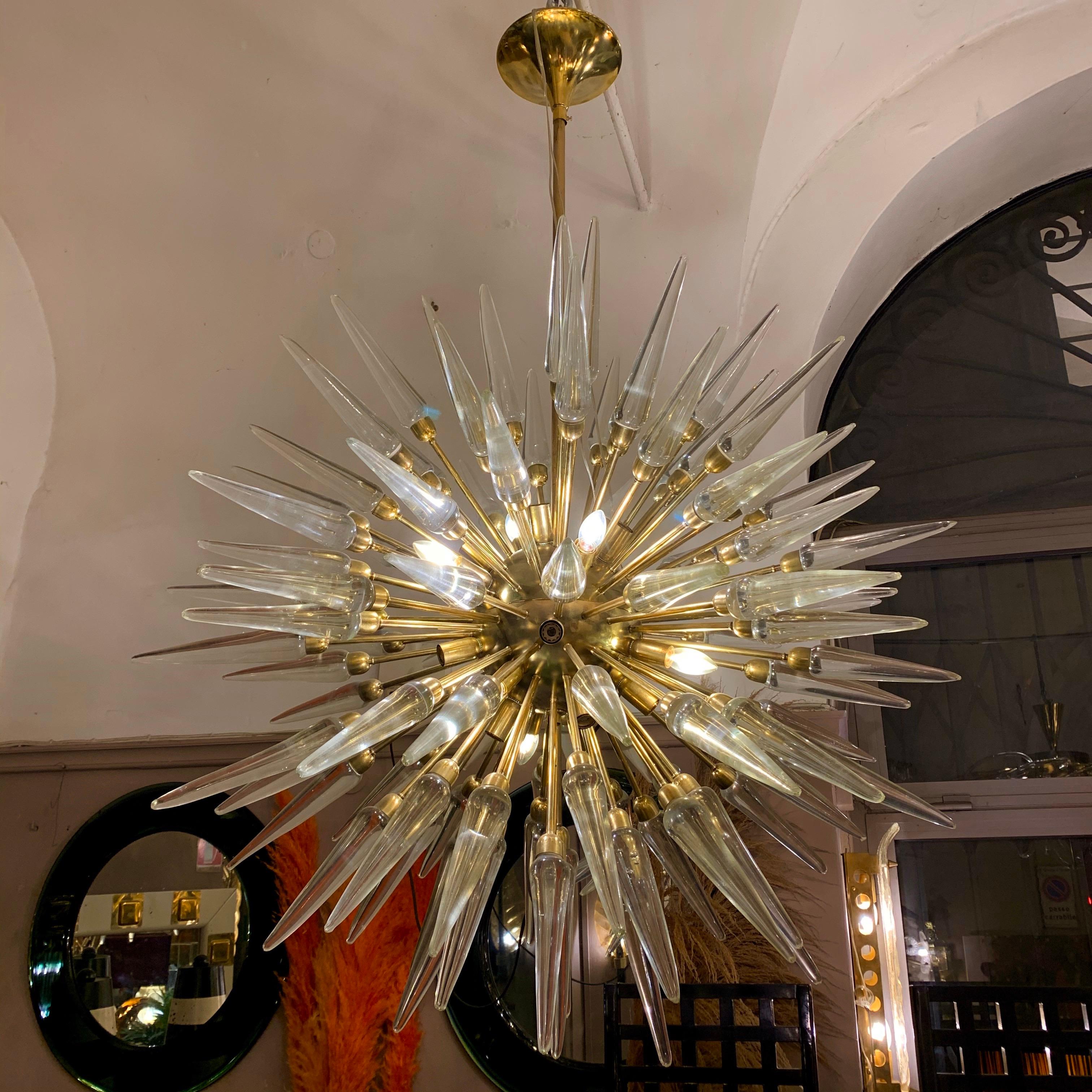 Brass Sputnik chandelier with Murano solid clear glass tips.
The chandelier has 24-light bulbs.
  