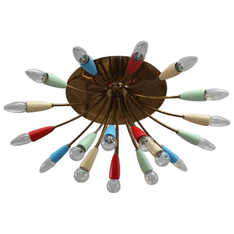Brass sputnik flush mount,
Arredoluce, Italy, 1950.
21 colorful cones,
21 bulb sockets E 14.