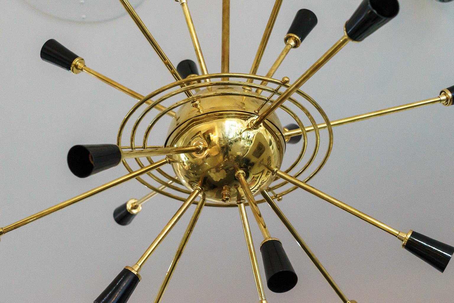 This rare, large scale, stylish and chic 18 light Sputnik chandelier with the three rings of Saturn are attributed to Stilnovo, circa 1955. The piece was acquired from Milaflores estate in Lima, Peru and has been professionally hand polished and