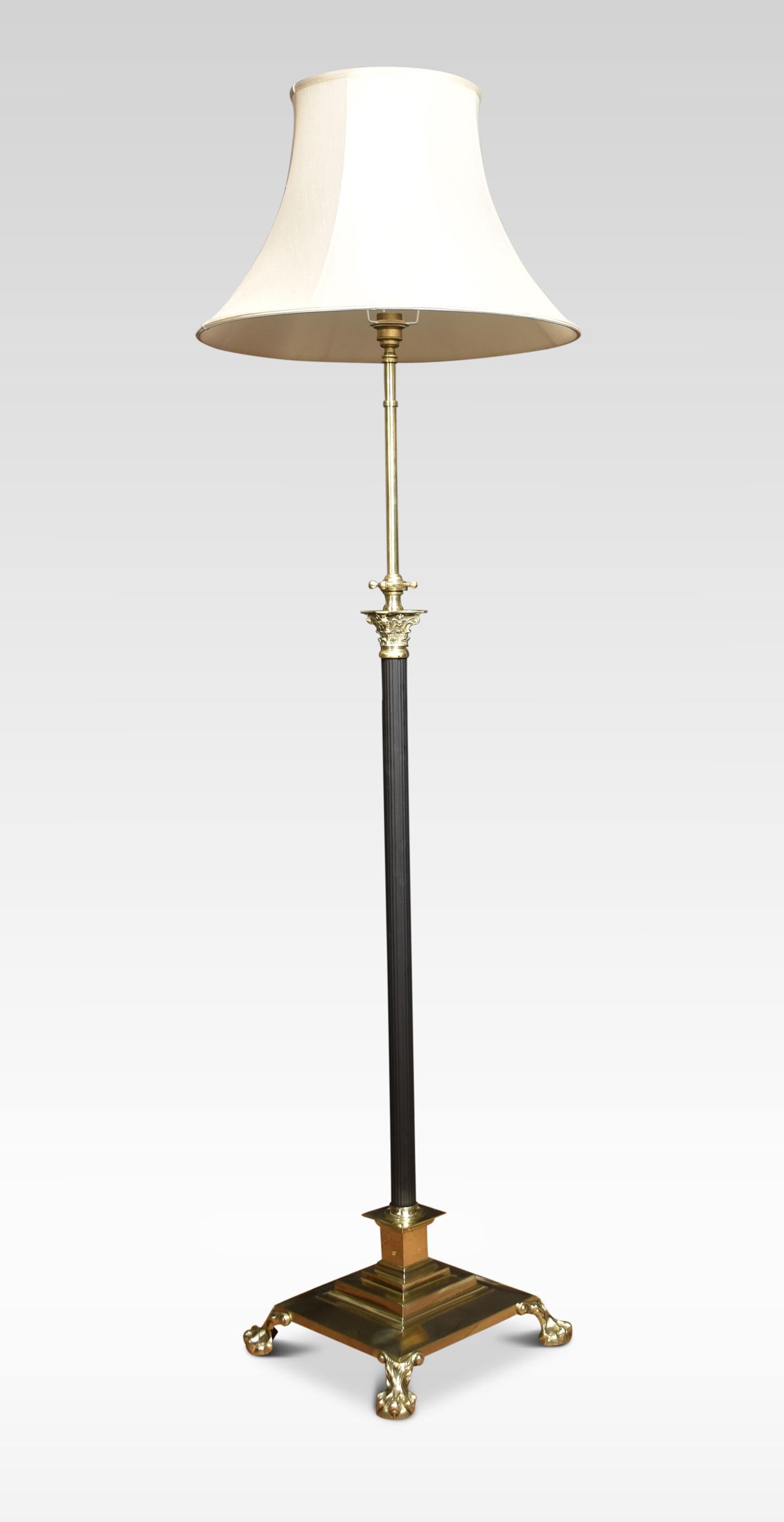 19th century brass standard lamp. Having ebonized Corinthian column and adjustable stem, on a stepped square base with paw feet.
Dimensions
Height 52 Inches adjustable to 79 inches
Width 14.5 inches
Depth 14.5 inches.