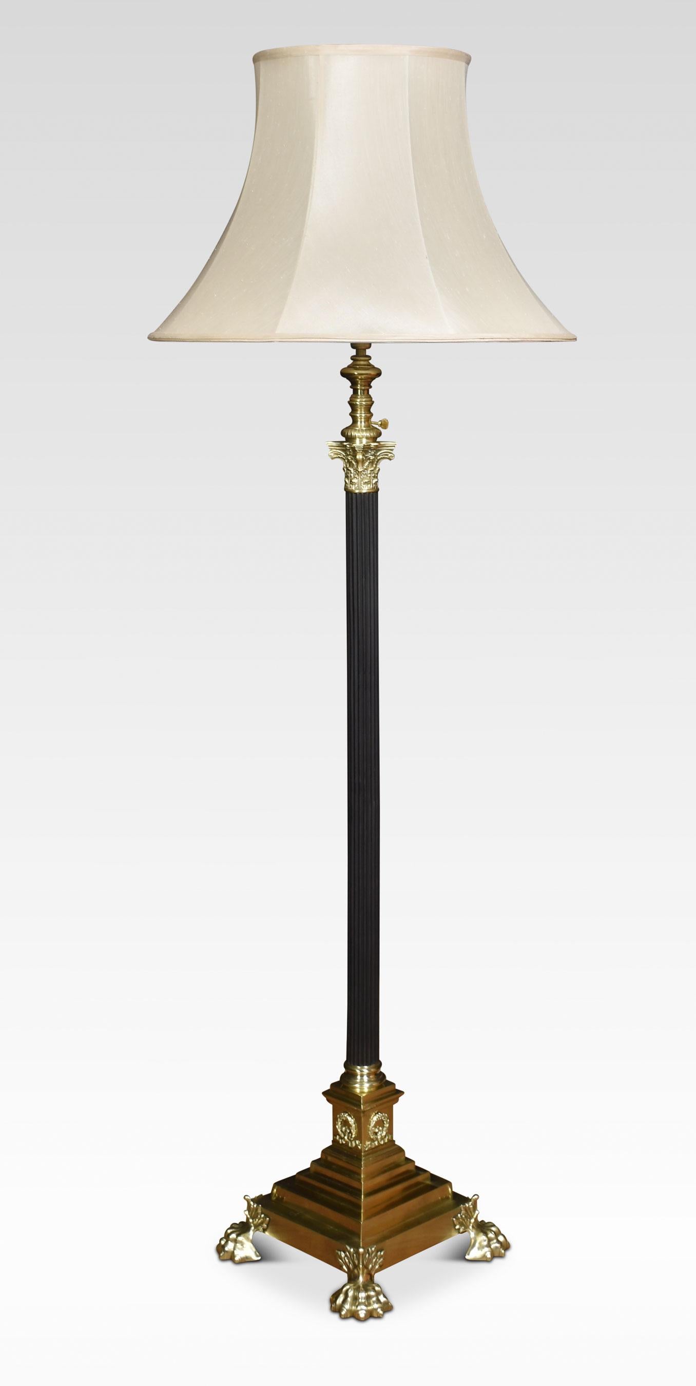 19th Century brass standard lamp. Having ebonized Corinthian column and adjustable stem, on a stepped square base with paw feet. Converted for electricity.
Dimensions
Height 49.5 Inches adjustable to 71 Inches
Width 12 Inches
Depth 12 Inches.