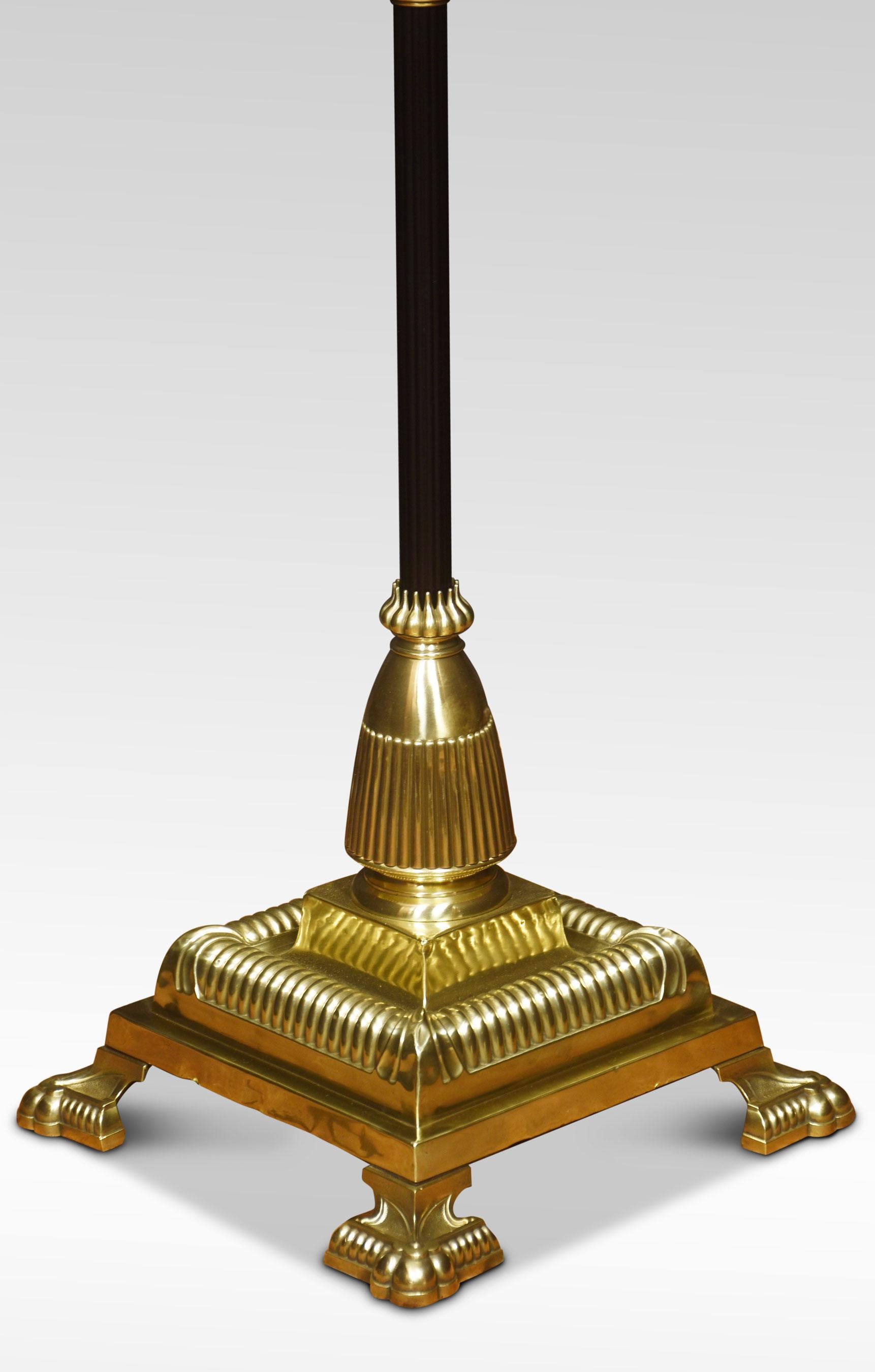19th Century brass standard lamp. Having decorated oil reservoir above the ebonized Corinthian column and adjustable stem, on a large stepped square base with paw feet. The lamp has been rewired. Converted for electricity.
Dimensions
Height 56.5