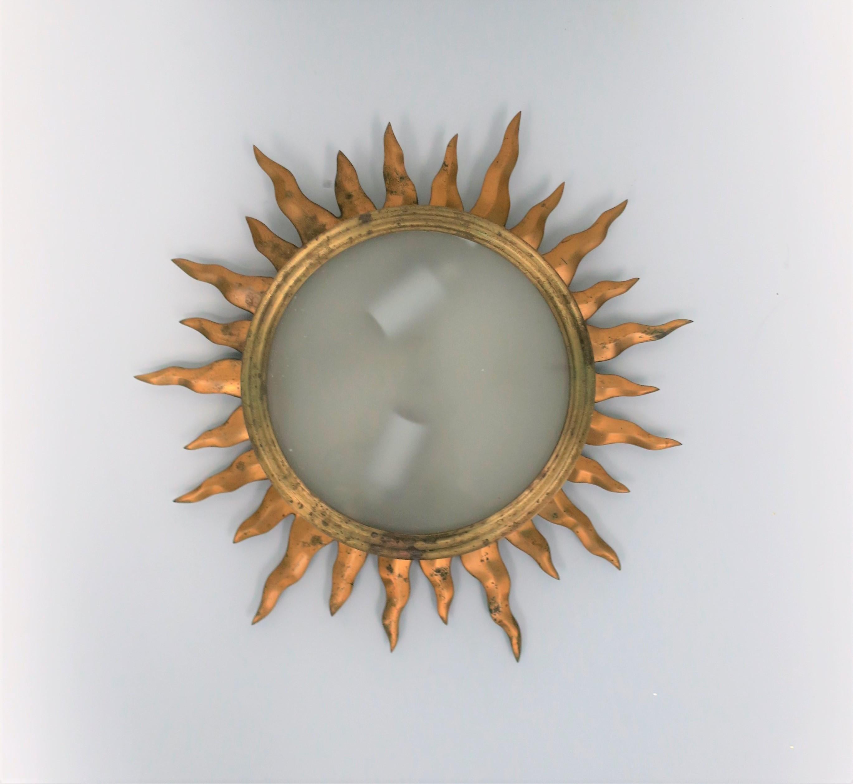 Vintage brass and white/translucent glass starburst flush mount (flushmount) ceiling light, circa Mid-20th Century. 

Measurements: 2