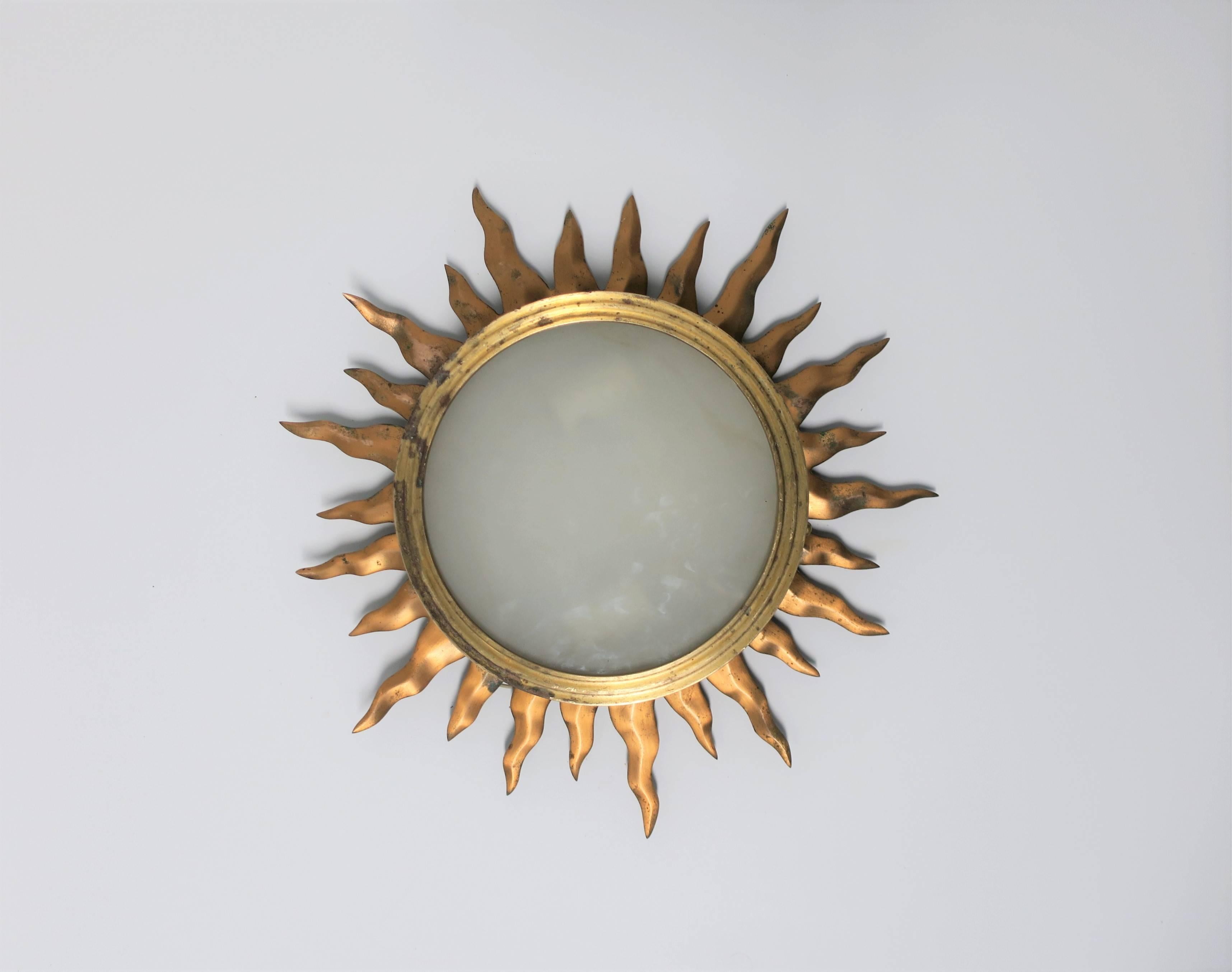 Vintage brass and translucent glass starburst flush mount (flushmount) ceiling light. 
There are two available. Lights are being sold individually.

Measurements: 2 in. height x 15 in. diameter
Light/lamp area only: 8.25 in. diameter.

Second light