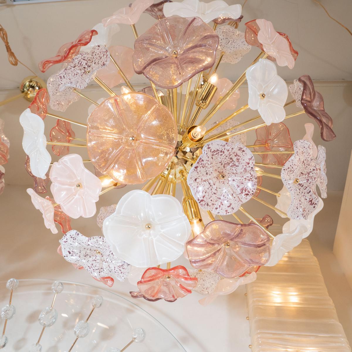 Brass starburst pendant fixture with pink and white glass floral design. 
12 candelabra.