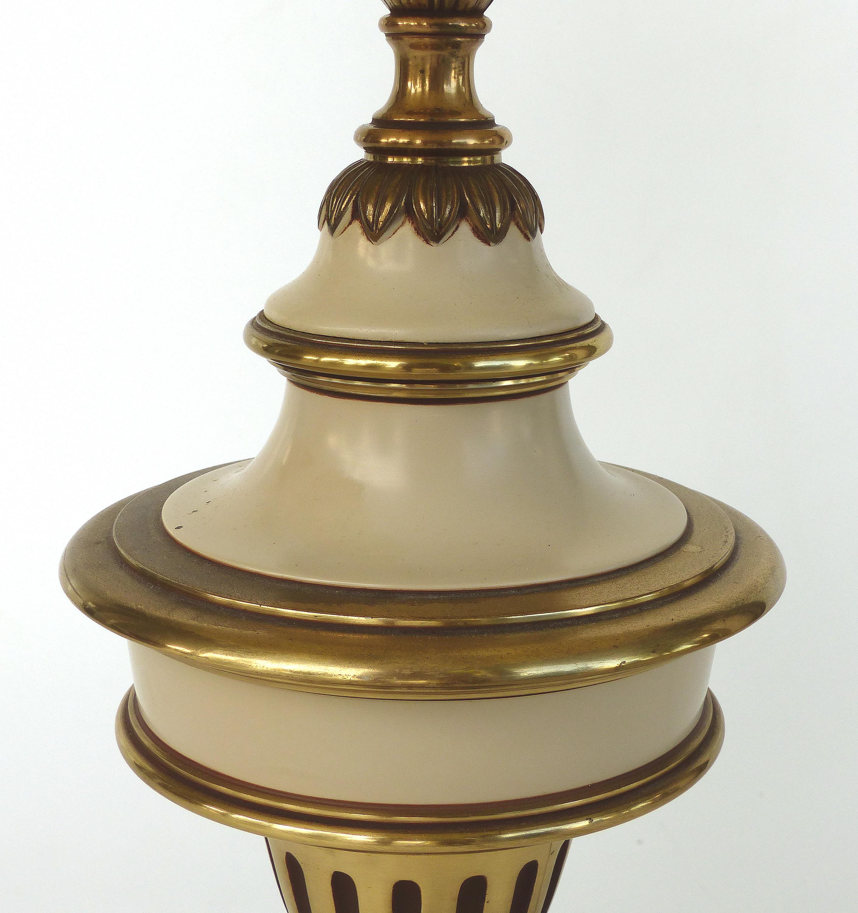Brass Stiffel Table Lamps, Pair

Offered for sale is a pair of brass and painted brass table lamps from Stiffel. The lamps have switches on the classic style plinth bases, and have the shades that came with them but they are not marked. The top of