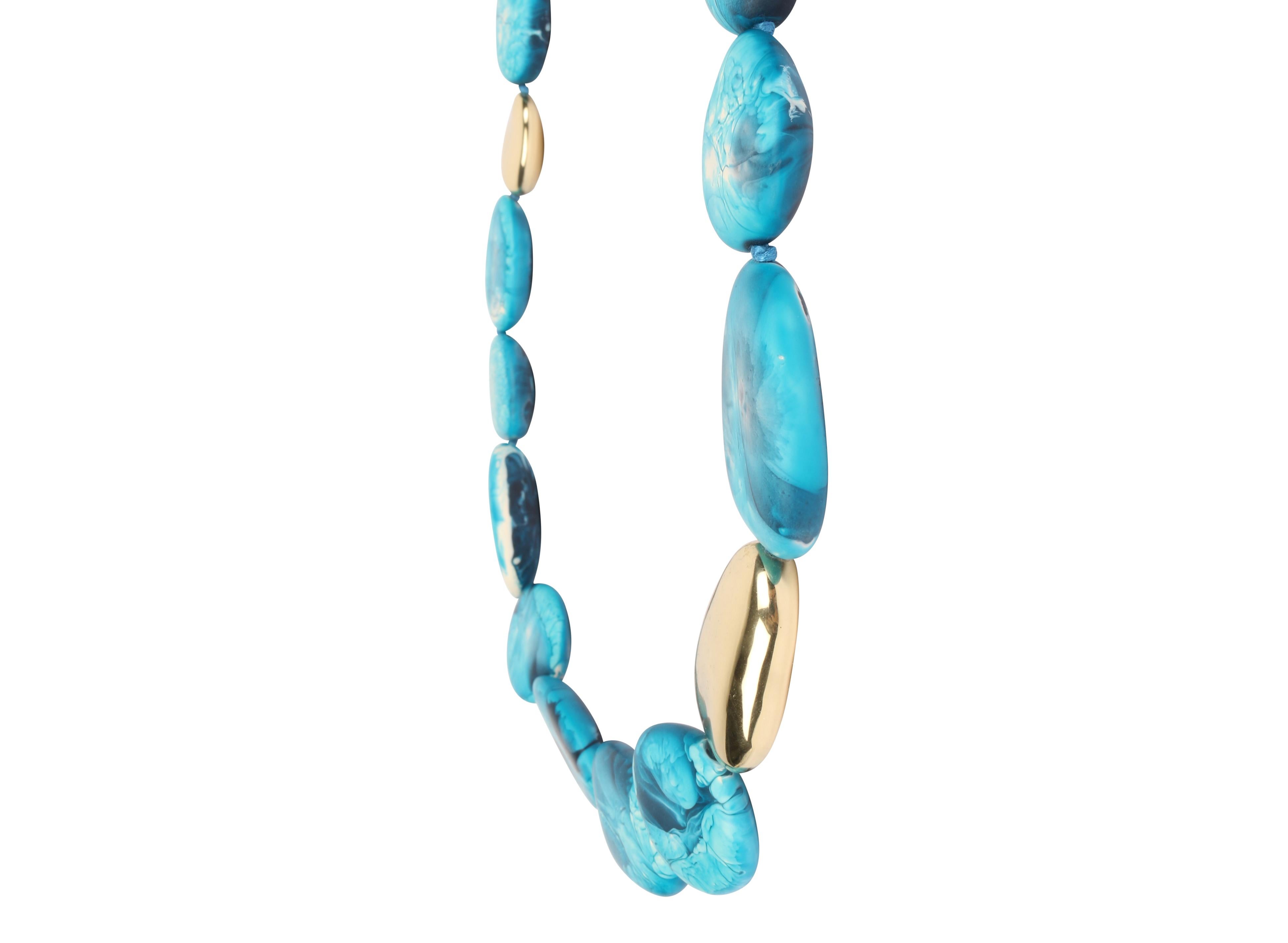 Resin beaded necklace with brass stone detailing. This necklace is featured in our Classic colour, Moody Blue. 

Dinosaur Designs resin products are hand made in Sydney, Australia. Each piece is unique and we cannot guarantee you will receive an