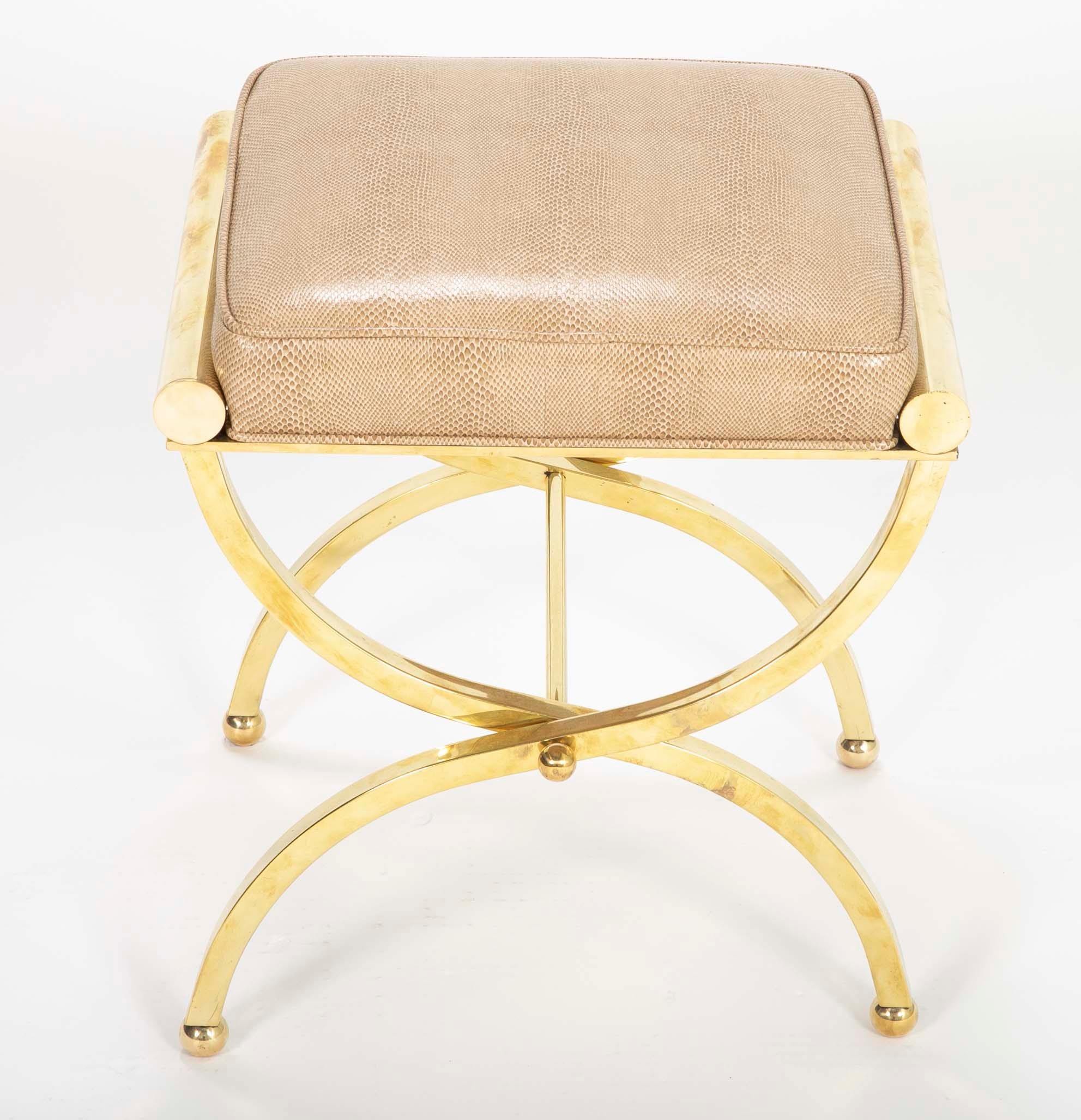 A brass stool in the manner of William Billy Haines by Jebejian Brothers with vinyl upholstery. Hollywood.