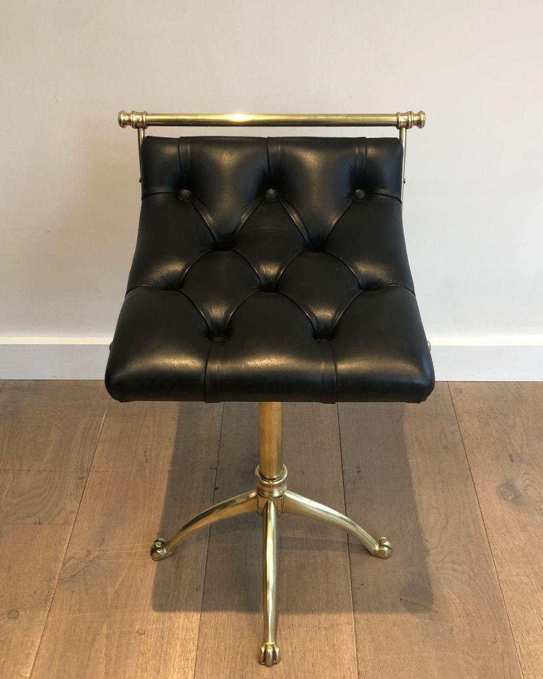 Brass stool with claw feet and leather seat. French work in the style of Maison Jansen. Circa 1940
