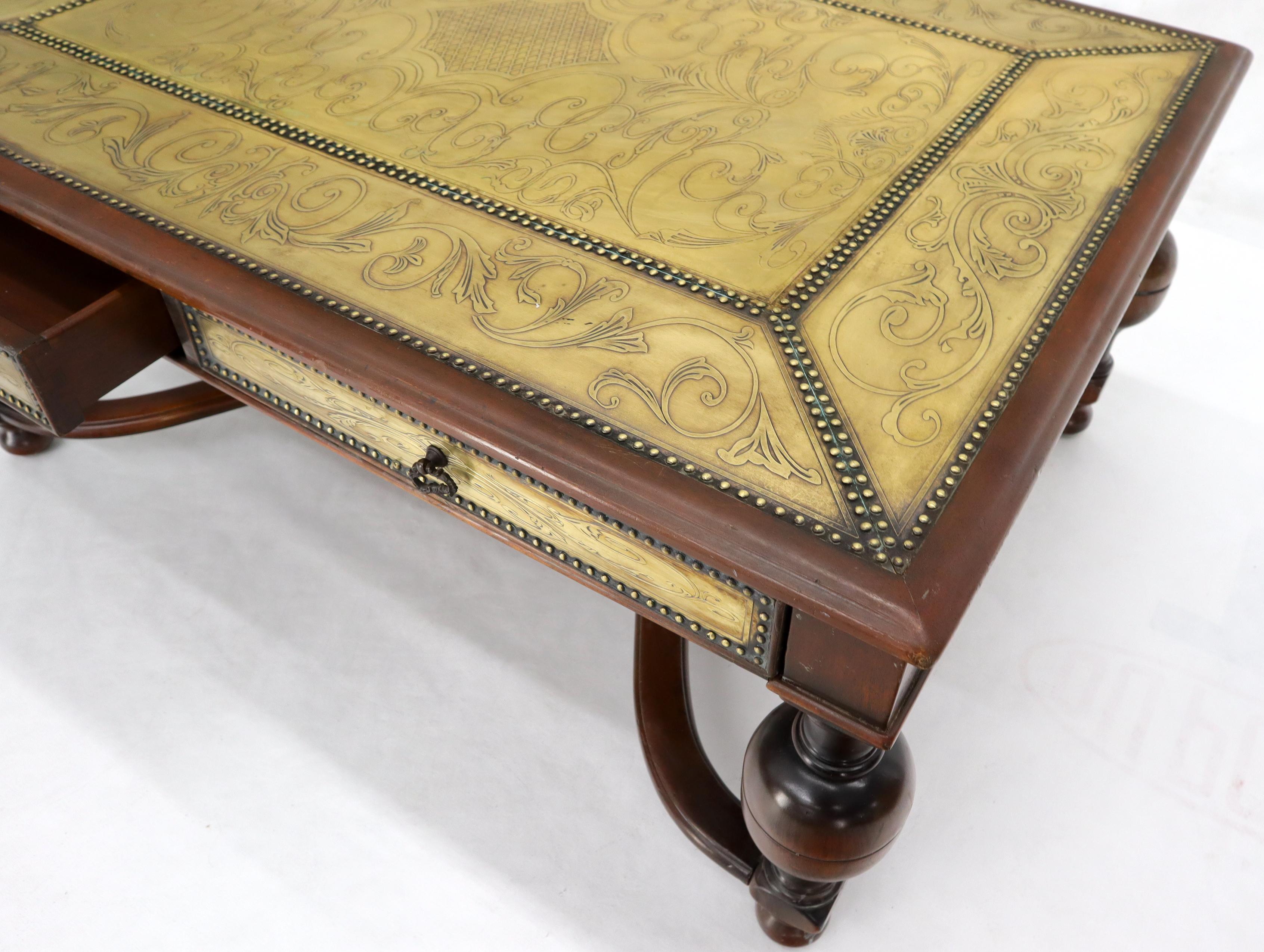 Figural carved and stretchers thick turned legs base embossed and studded brass top coffee table.
