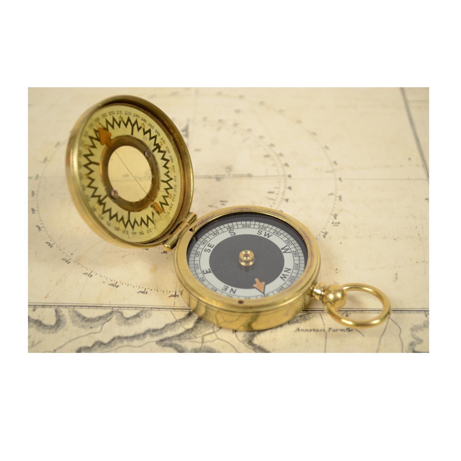 Brass nautical travel survey compass, made in 1914 circa, signed The Magnapole; small compass used away from magnetic fields to check the ship's course. The compass is complete with a goniometric circle and the block of compass card. Measure: