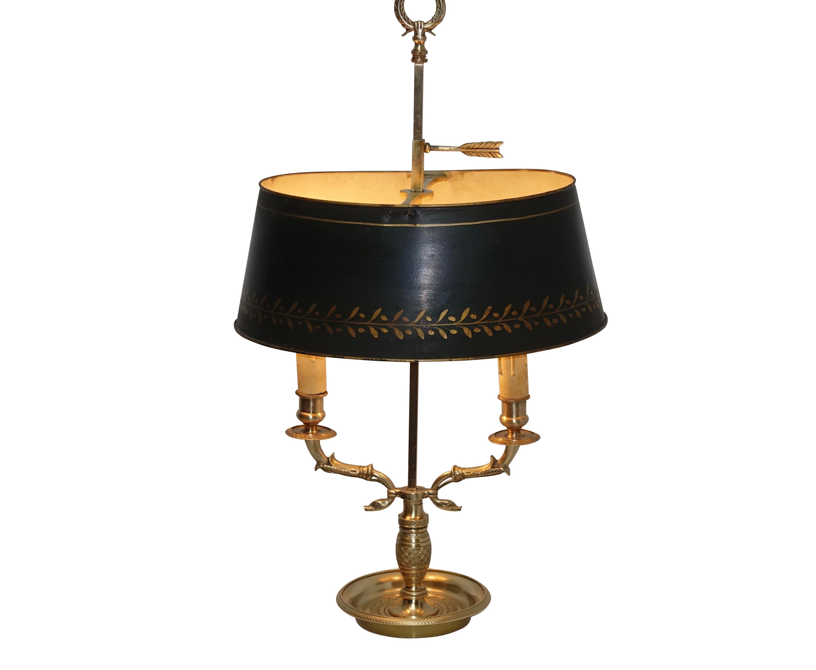 Brass two-light swan neck bouillotte lamp with oval shape black painted and gilt accented tole shade. Converted to electric in the early 20th century, France, mid-19th century.