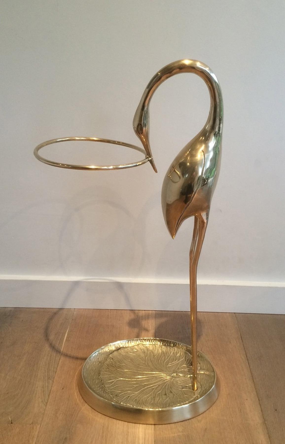 This rare and very elegant swan umbrella stand is all made of brass. This is a finely chiseled French work attributed to famous designer Maison Jansen. Circa 1970.