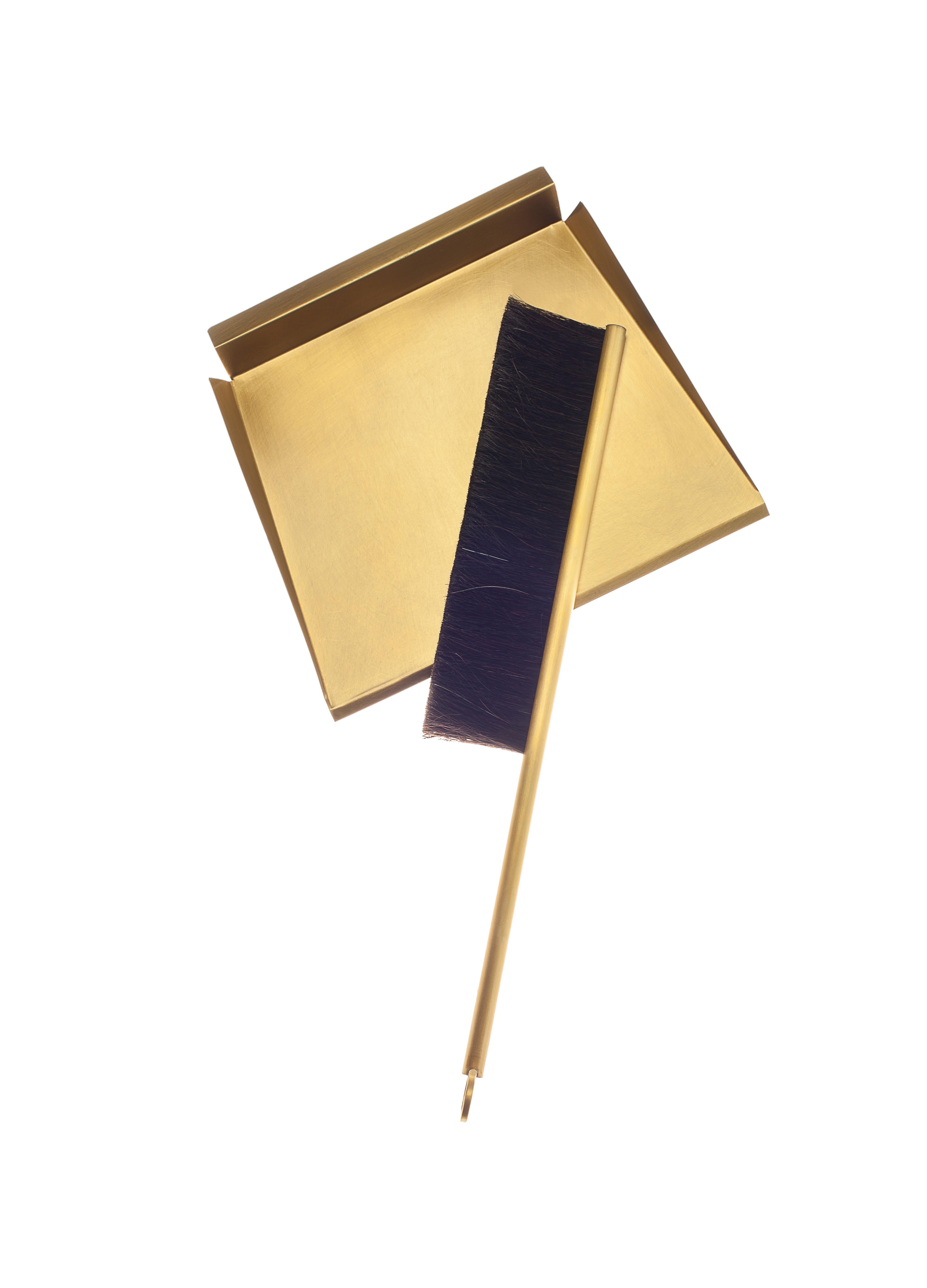 Brass Sweep dustpan and brush by Gentner Design
Dimensions: D 20 x W 18 x H 6.3 cm
Materials: tarnished brass, horsehair

This dust pan and brush bring a whole new dimension to cleaning. Made of brass and horsehair, the set comes with a magnetic peg
