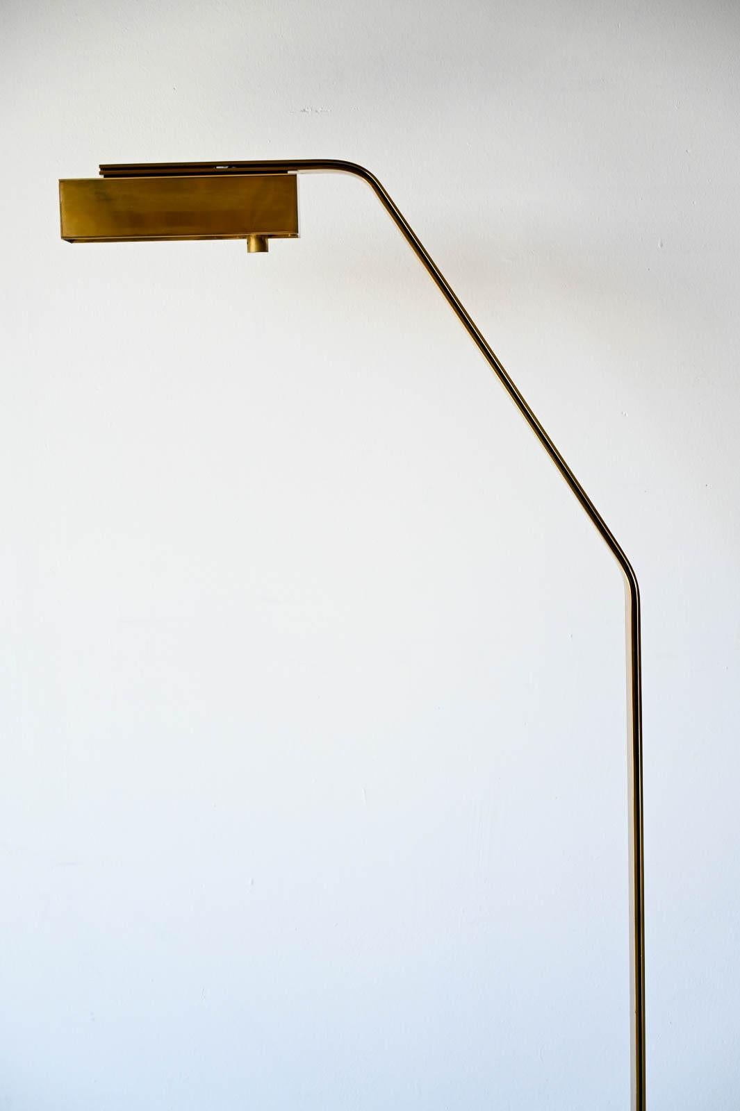 Brass Swing Arm Floor or Reading Lamp by Casella, ca. 1970.  Polished brass base with swivel arm neck and adjustable dimmable light.  Perfect reading lamp for a chair or end of sofa.  Very good vintage condition, this is a beautiful lamp for your