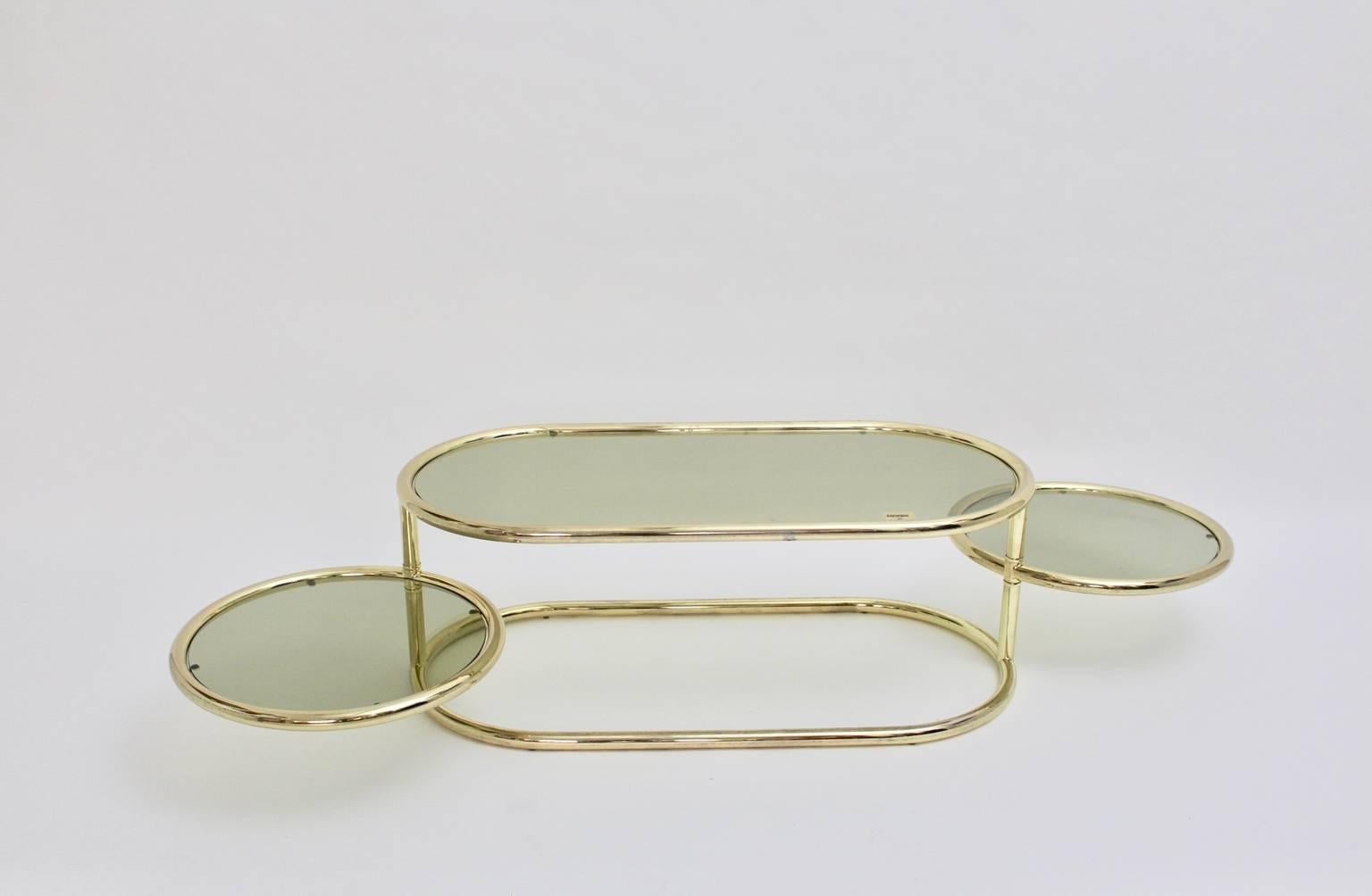 20th Century Brass Swiveling Vintage Coffee Table Green Smoked Glass Plates by Morex 1970s