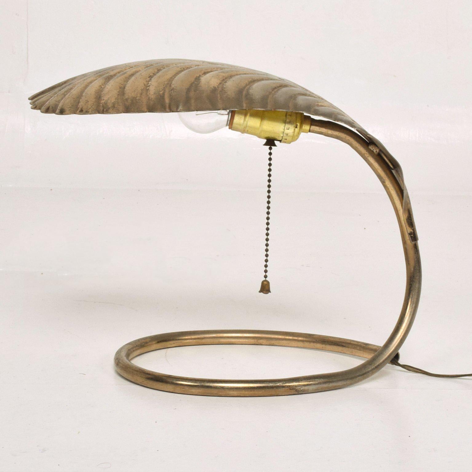 For your consideration a brass table lamp after Tommaso Barbi.
Solid brass with a large leaf brass shade.

No stamp from the maker.

Measures: 9