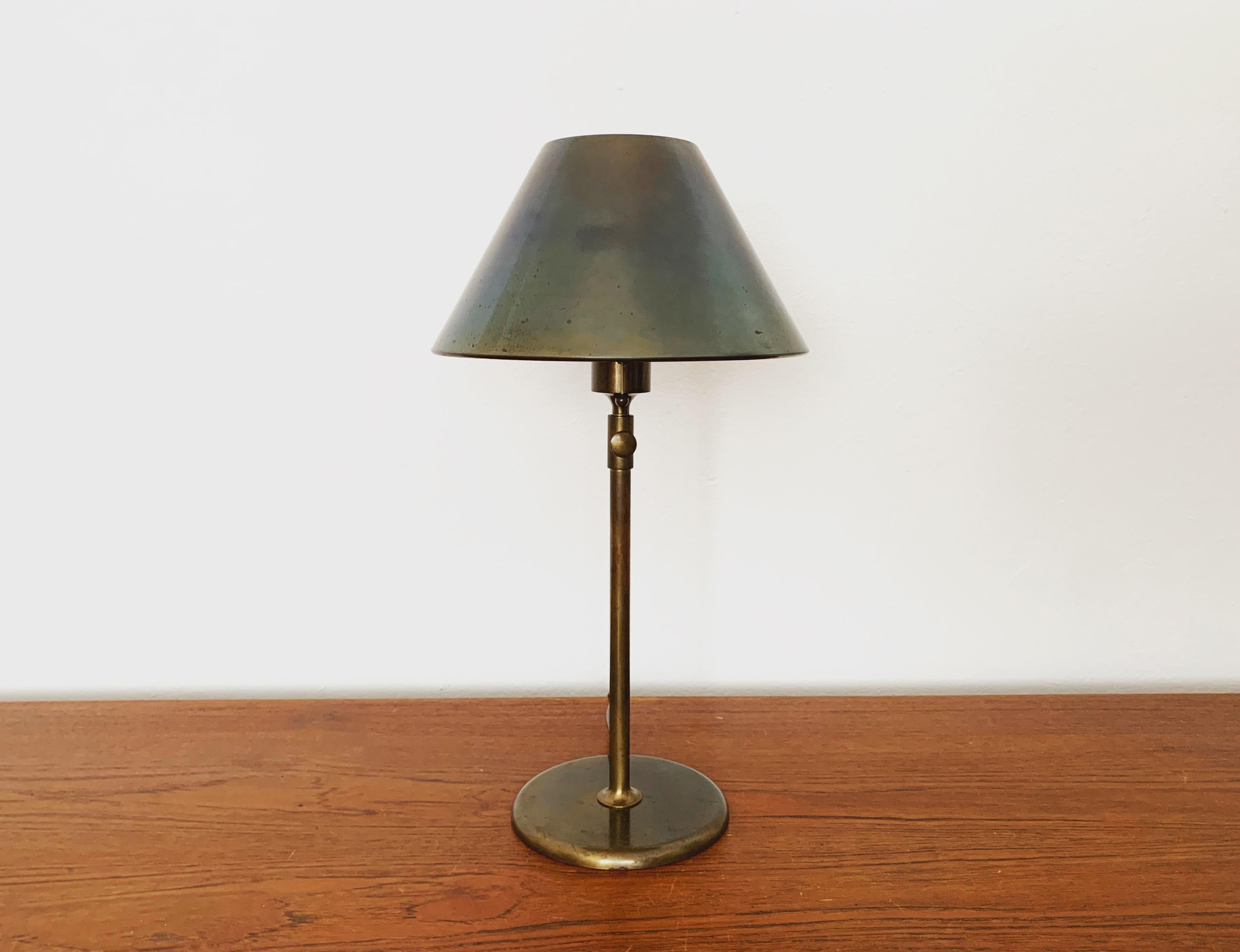 Very beautiful and extremely rare height-adjustable brass table lamp from the 1970s.
The design and the very beautiful details create a very noble and pleasant light.
The lamp creates a very cozy atmosphere and is of very high quality.
Infinitely