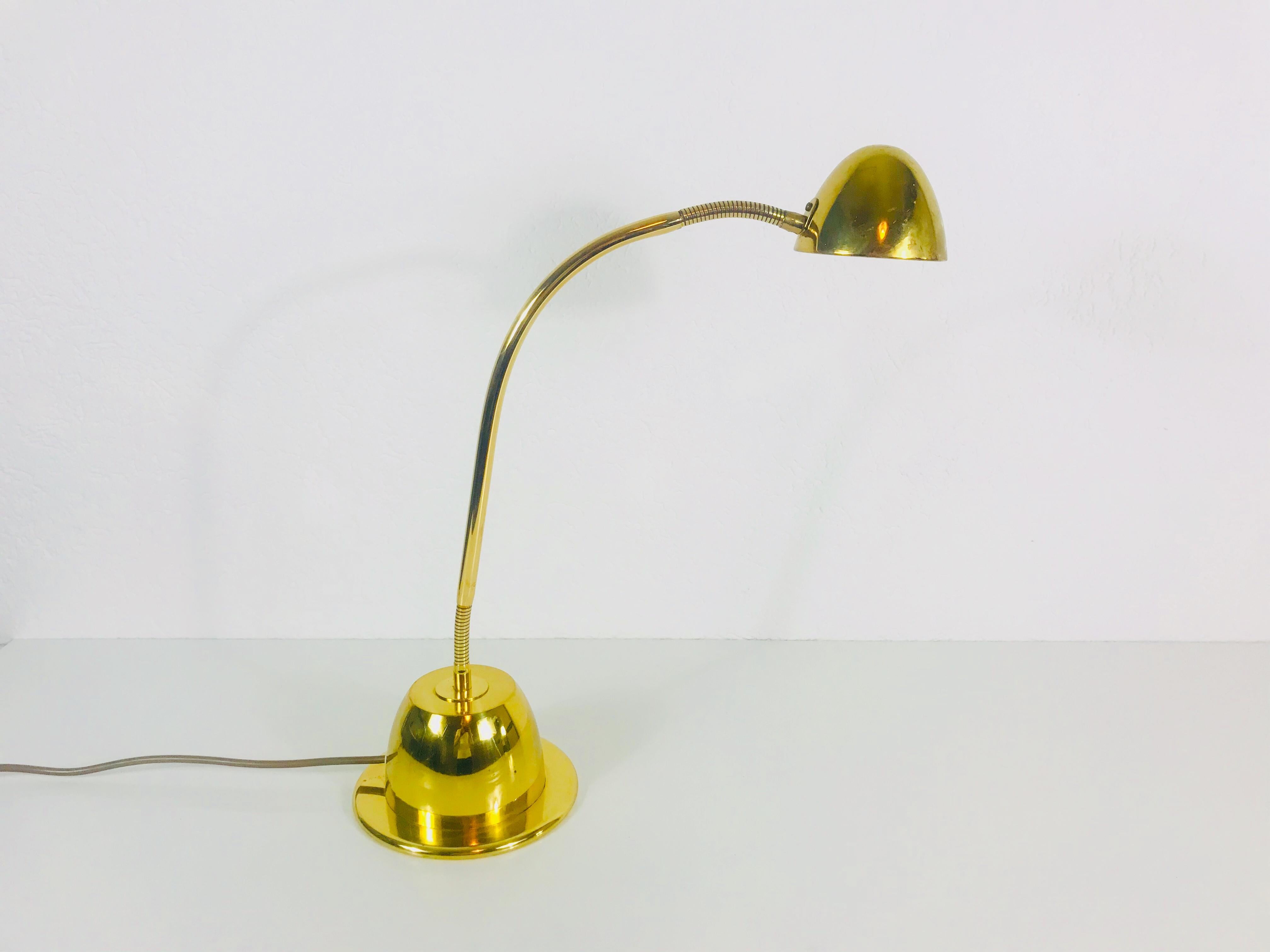 A brass table lamp by Schröder Leuchten made in Germany in the 1960s with a fantastic rare adjustable body.

Measurements:

Height: 50 cm

Diameter of base: 17 cm.
 