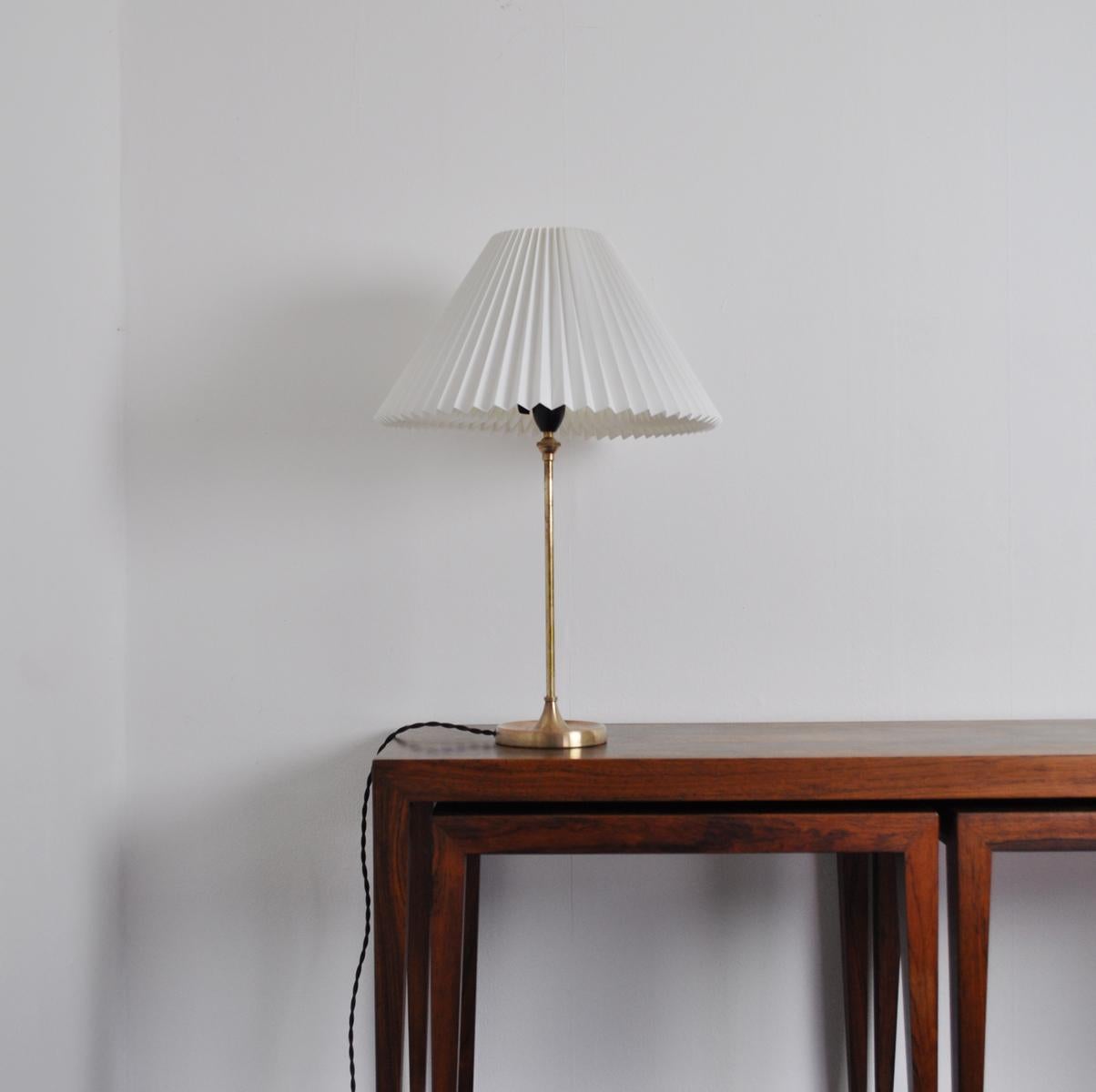 Old Model 307 table lamp designed 1948 by Esben Klint for the Danish lamp manufacturer Le Klint.

The table lamp is made of brass. This is a old model and therefore the brass contains a higher percentage of copper which gives a reddish glow. It