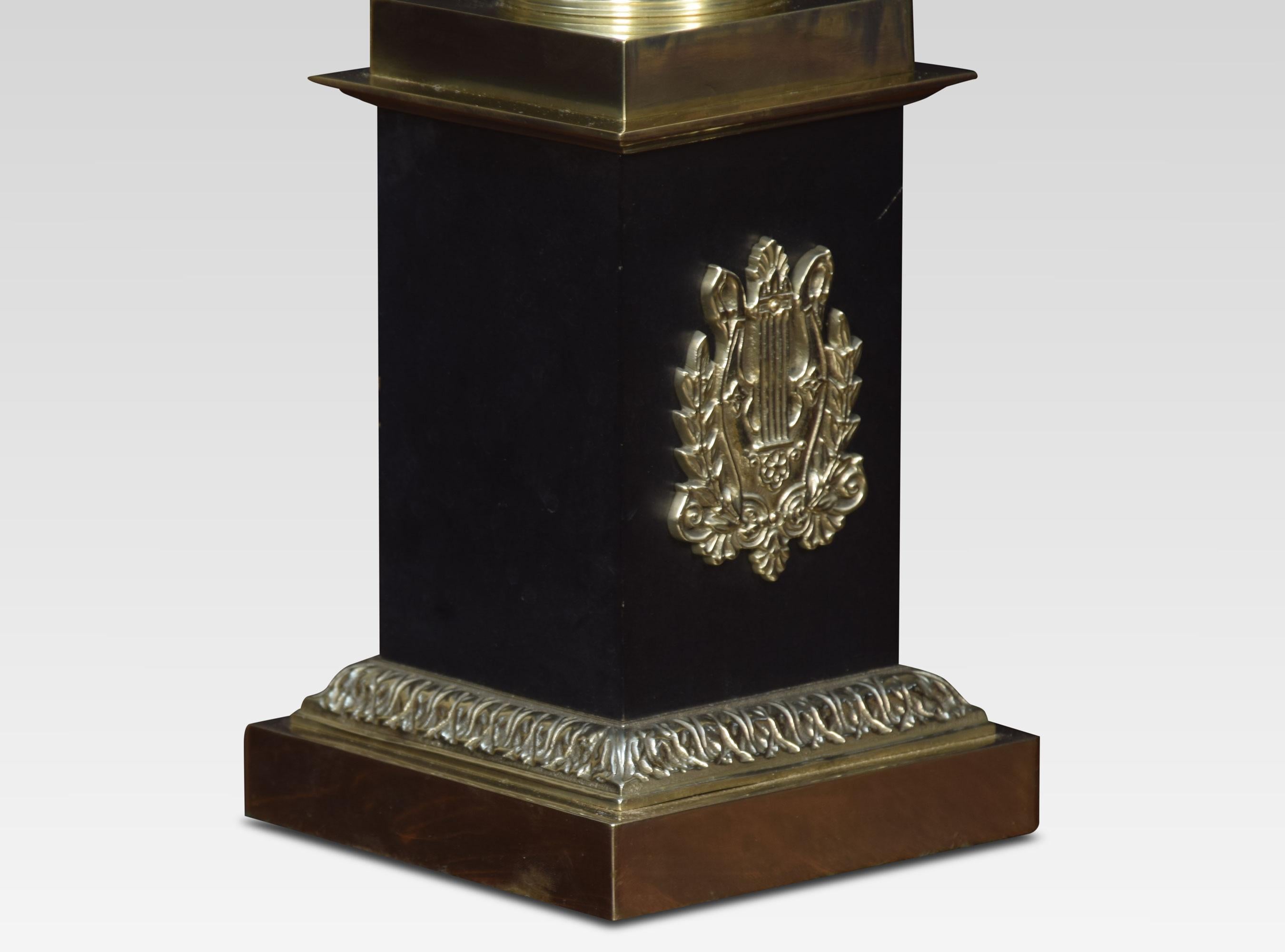 Brass table lamp of urn form above a stepped ebonized pedestal with central lyre motif. The lamp has been rewired.
Dimensions:
Height 20.5 inches
Width 7 inches
Depth 7 inches.