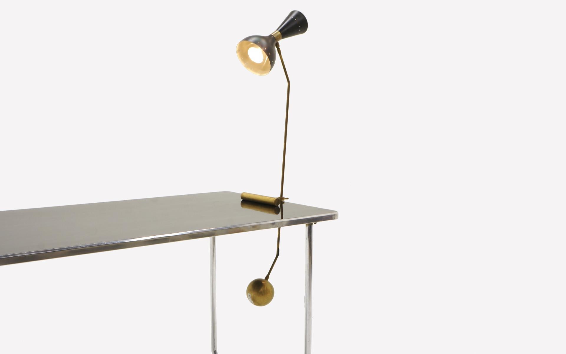 Large Italian counter-balance table or desk lamp by Stilnova. The height is adjustable as is the lamp fixture moves 360 degrees to direct light. Nice patina. Wired for US and ready to use.
