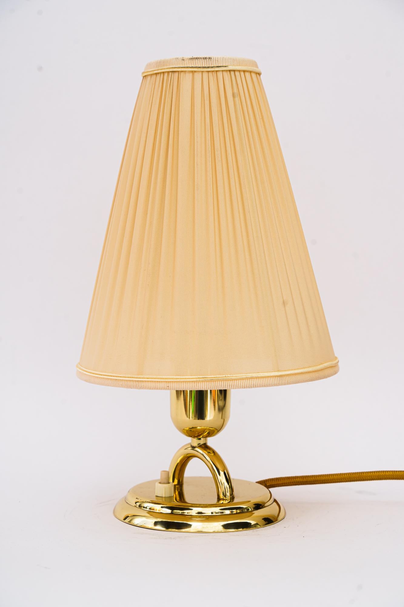 Brass Table lamp with fabric shade vienna around 1950s
Brass polished and stove enameled
The fabric shade is replaced ( new ).