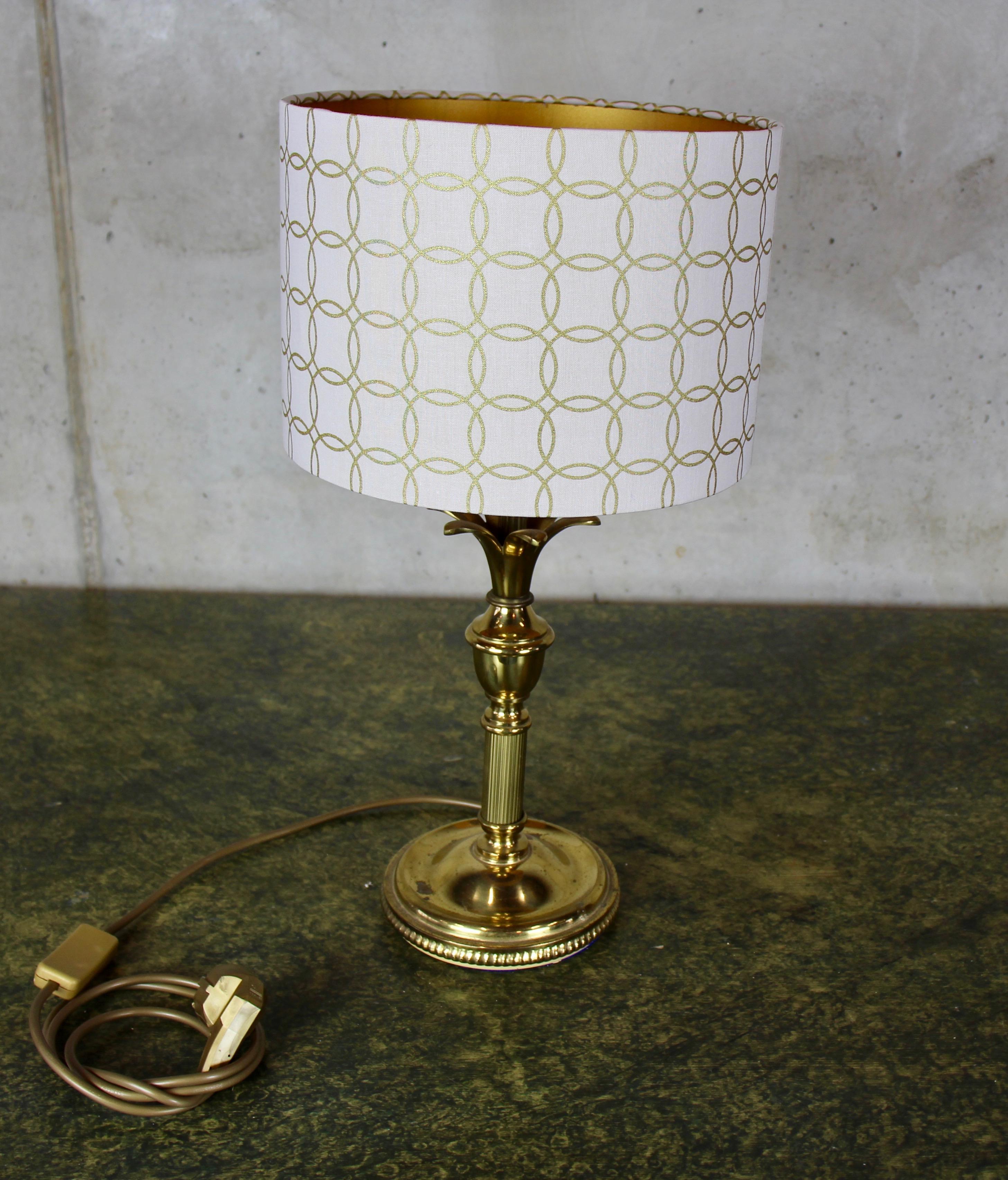 Beautiful table lamp from the 1970s. The lamp-nose is brassed metal. The electrics have been redone, the lampshade is new but has some mistakes