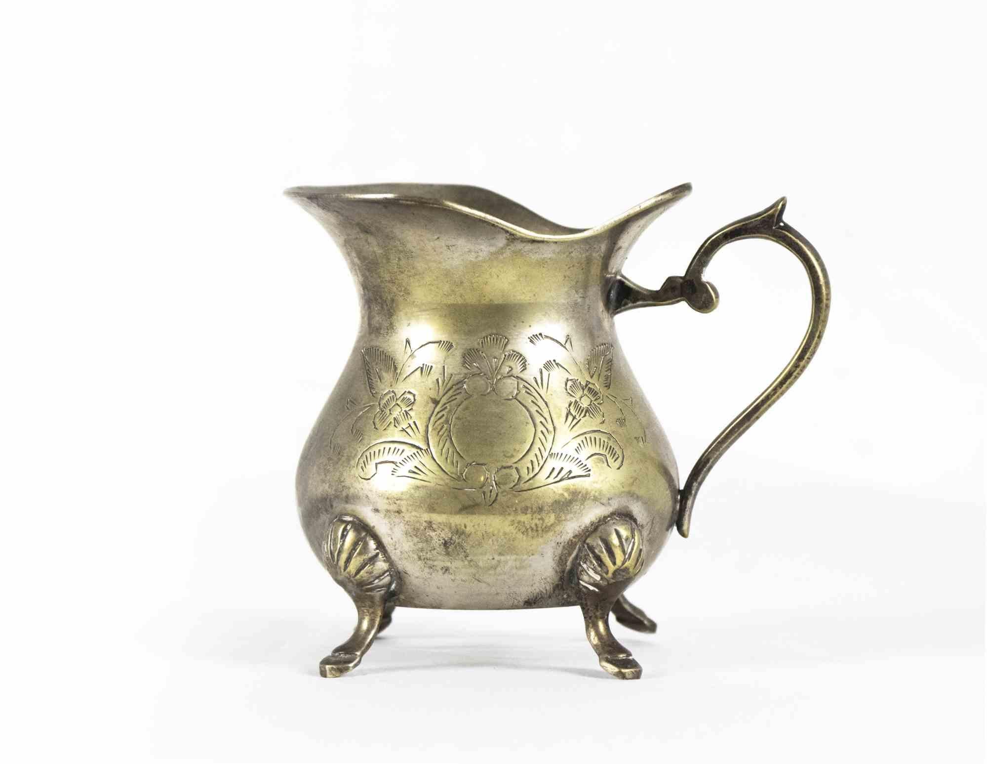 Brass tea set is an original decorative object realized in Europe in the early 20th century.

The set is realized in brass with chiseled decorations. 

The set includes: one tea pot, one coffee pot, a sugar bowl and a milk jug.

Various