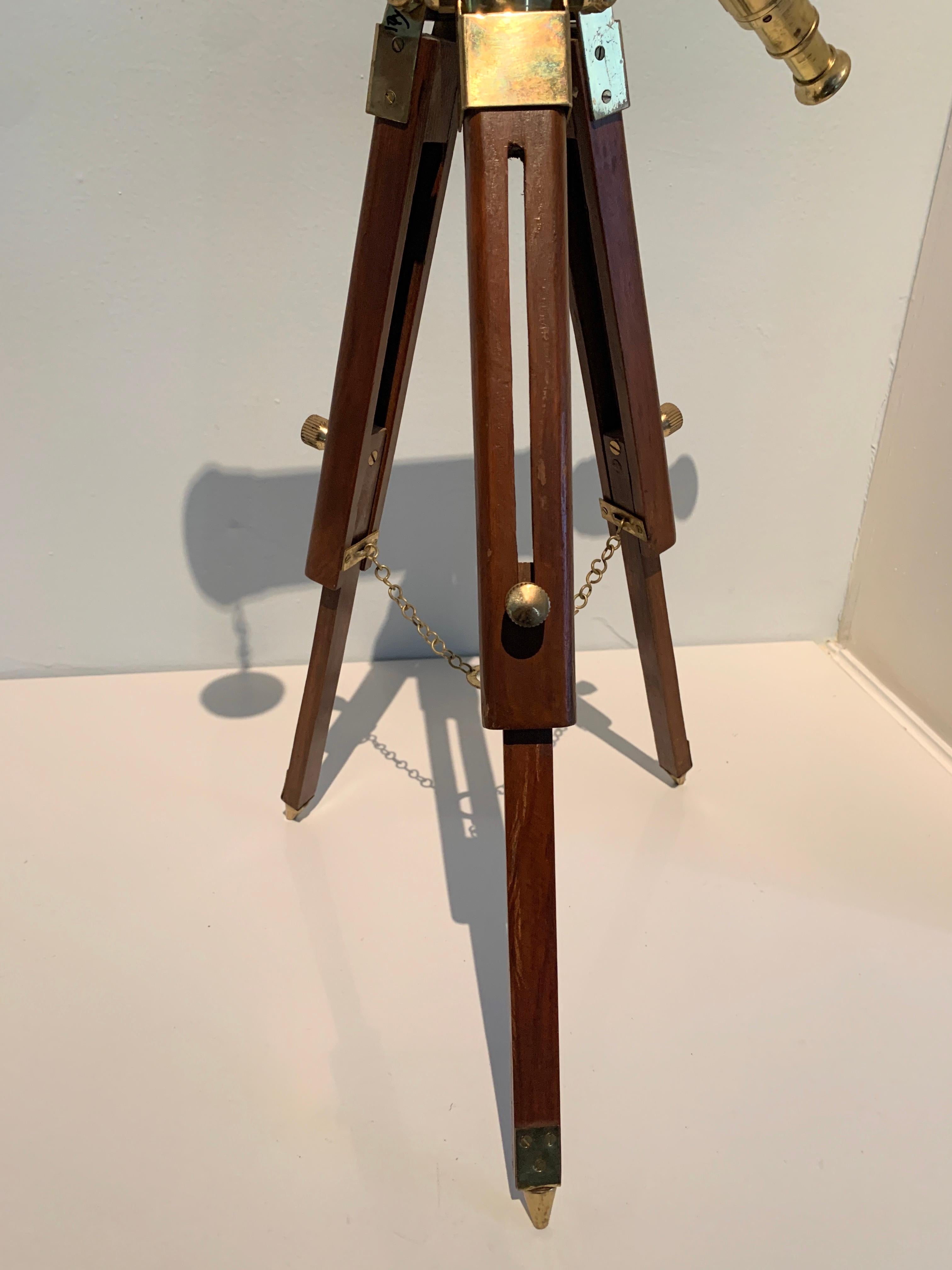 Tabletop / portable brass telescope on wooden and brass adjustable tripod - a wonderful 20th century telescope - a working piece, but a very nice decorative piece. A Ralph Lauren complement to a table full of books or ready to use on that star