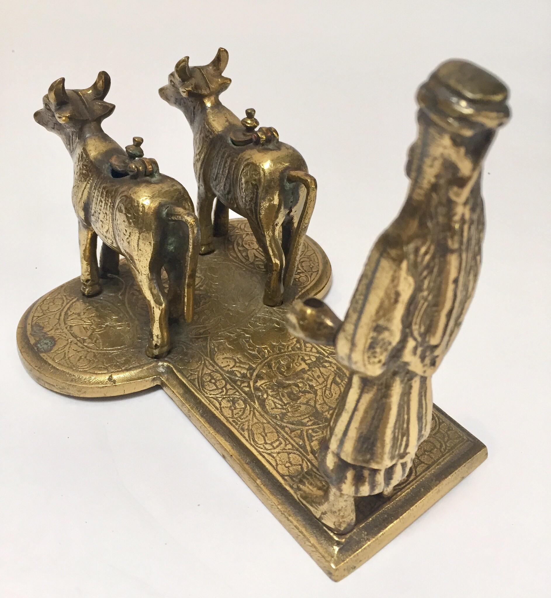 Brass Hindu Temple Oil Lamps Figures a Two Cows and Holly Man Standing For Sale 2