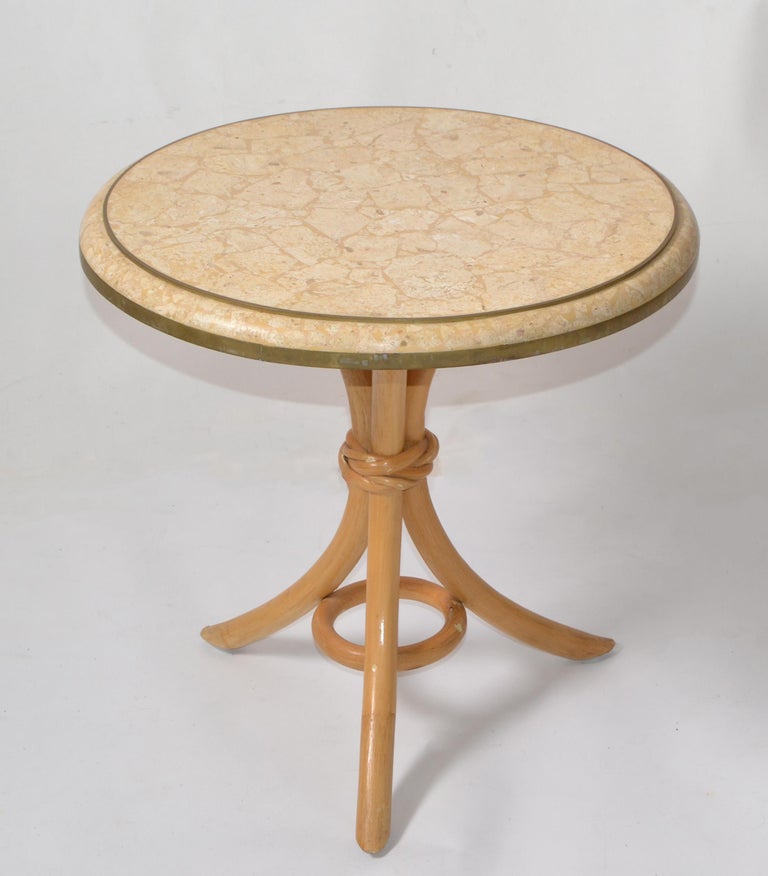 We offer a Maitland-Smith Style Mid-Century Modern round side, drink, end table made out of a Bend Bamboo Tripod Base with a Tessellated Stone over Wood Top.
The Stone Top has an inserted Brass Ring Decoration.
Asian Modern Design made in the