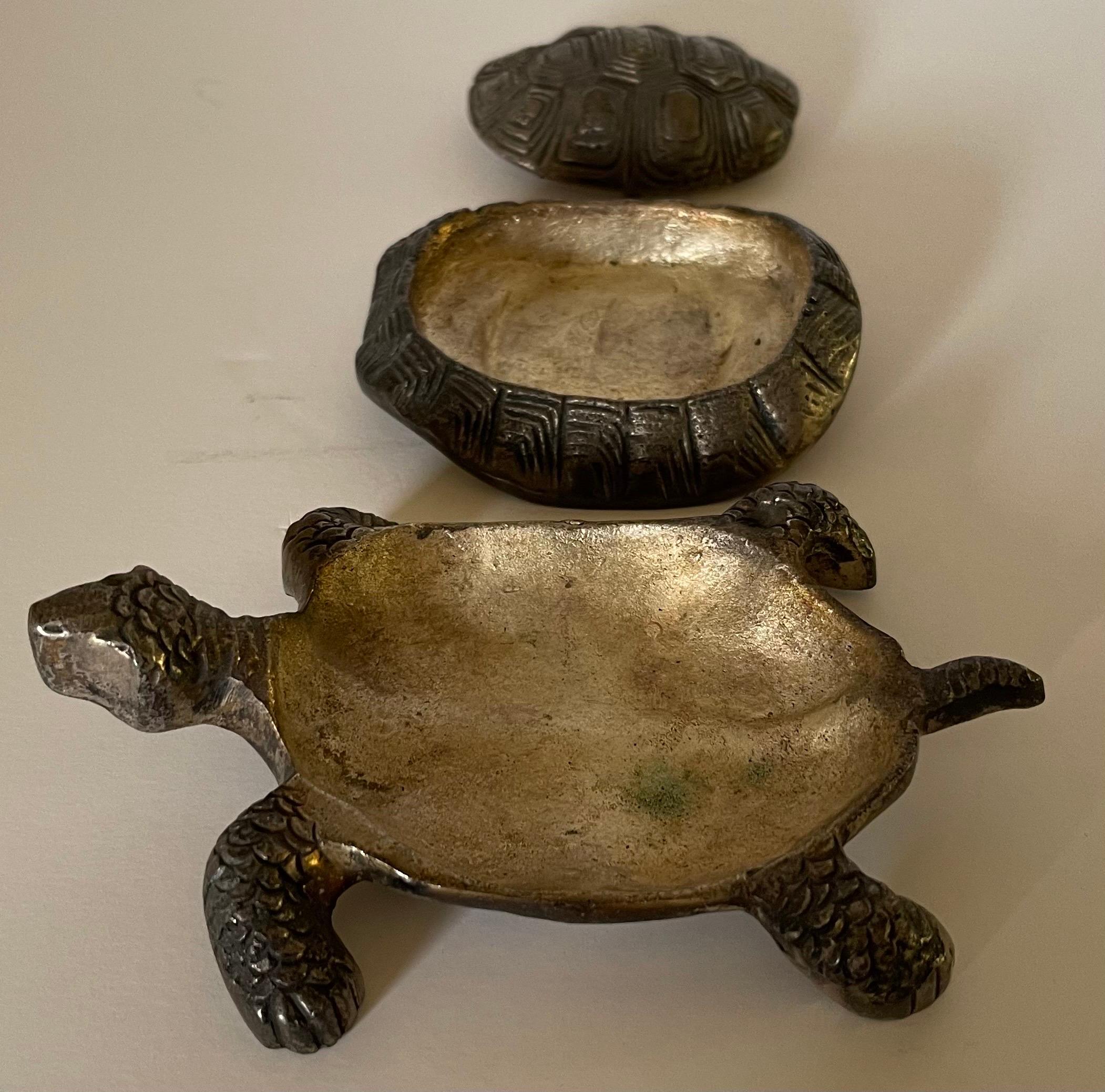 Mid century heavy brass turtle box. Three tiered shell with small storage compartments. Box is heavy and well made. Remnants of makers mark/ brand tag on the underside. 