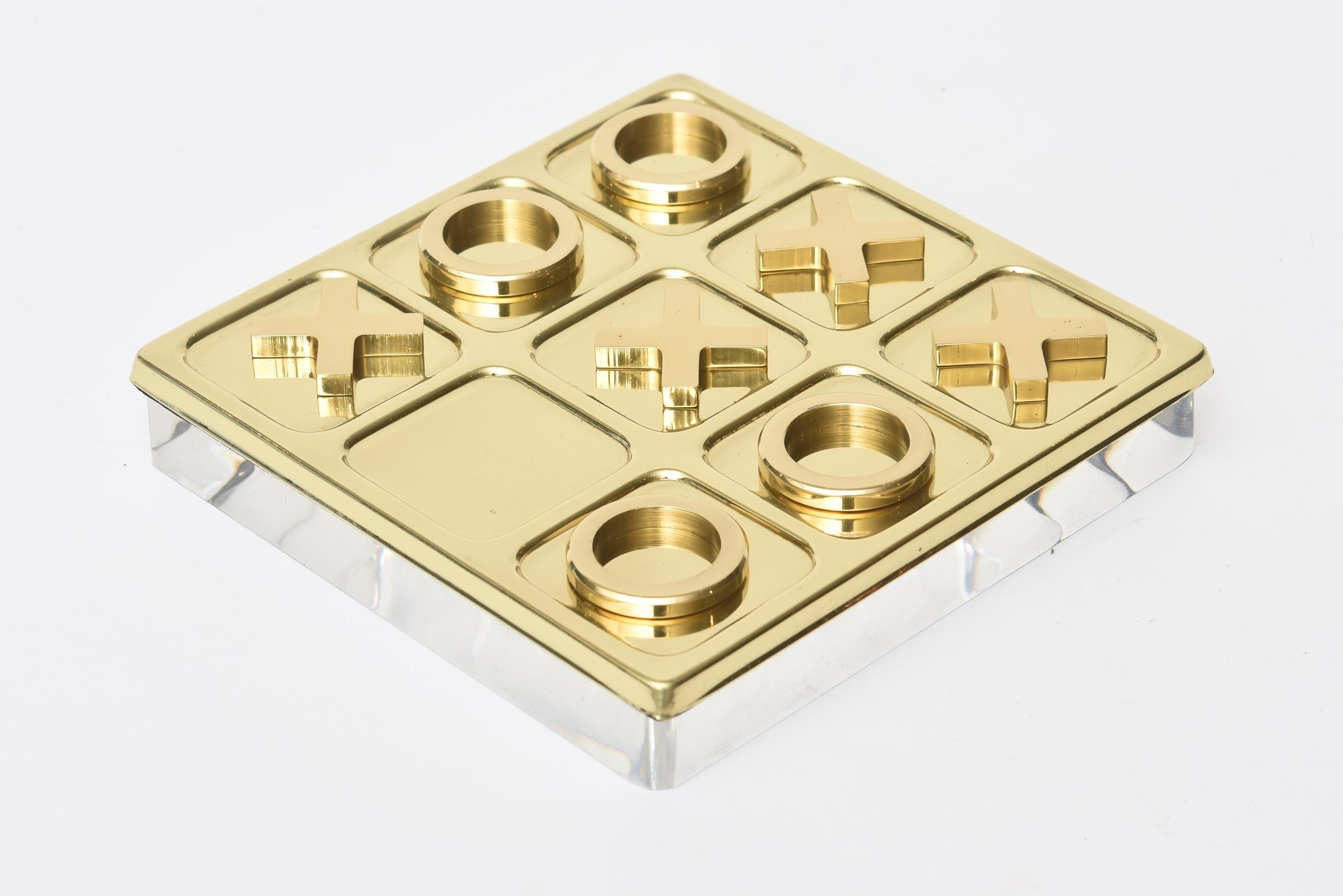 This vintage brass tic tac toe set and game has a new Lucite base the is not attached. It is Mid-Century Modern and was all polished professionally.
A great addition for any cocktail table, console or desk. It came in its original plastic box