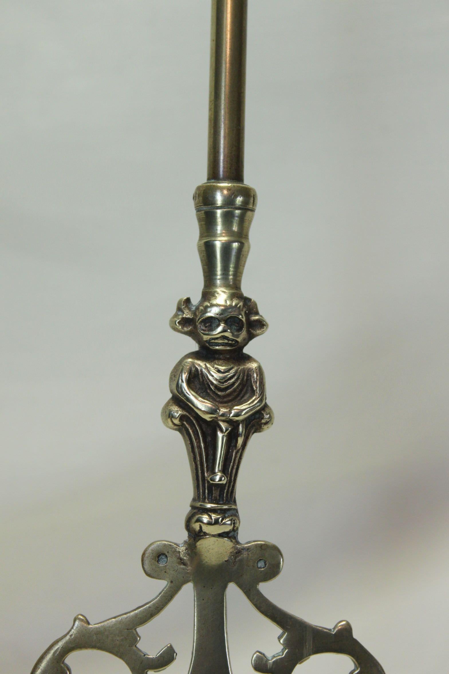 This decorative brass toasting fork is decorated with a good quality casting of the 