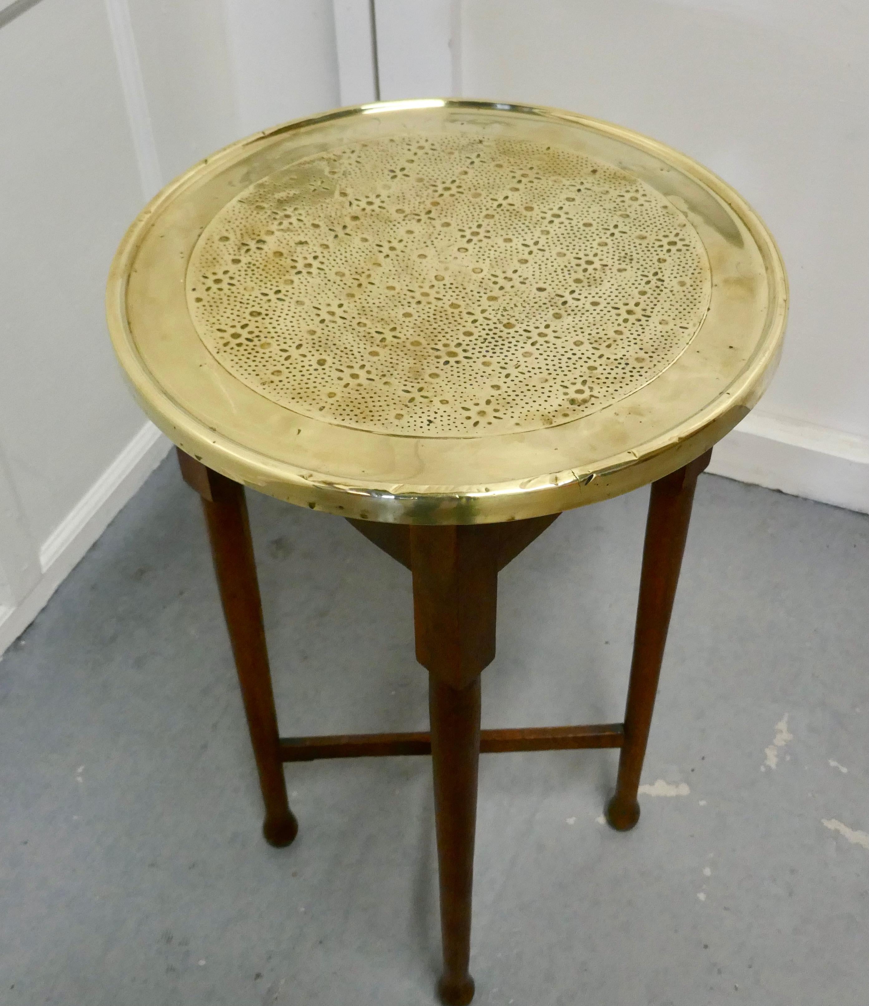 Brass top coffee table or occasional table.

The table stands on sturdy oak legs with an X stretcher and a hammered brass table top.
The 2” thick round table top is beautifully polished 

The table is 29.5” high and 218” in diameter
TGB522.