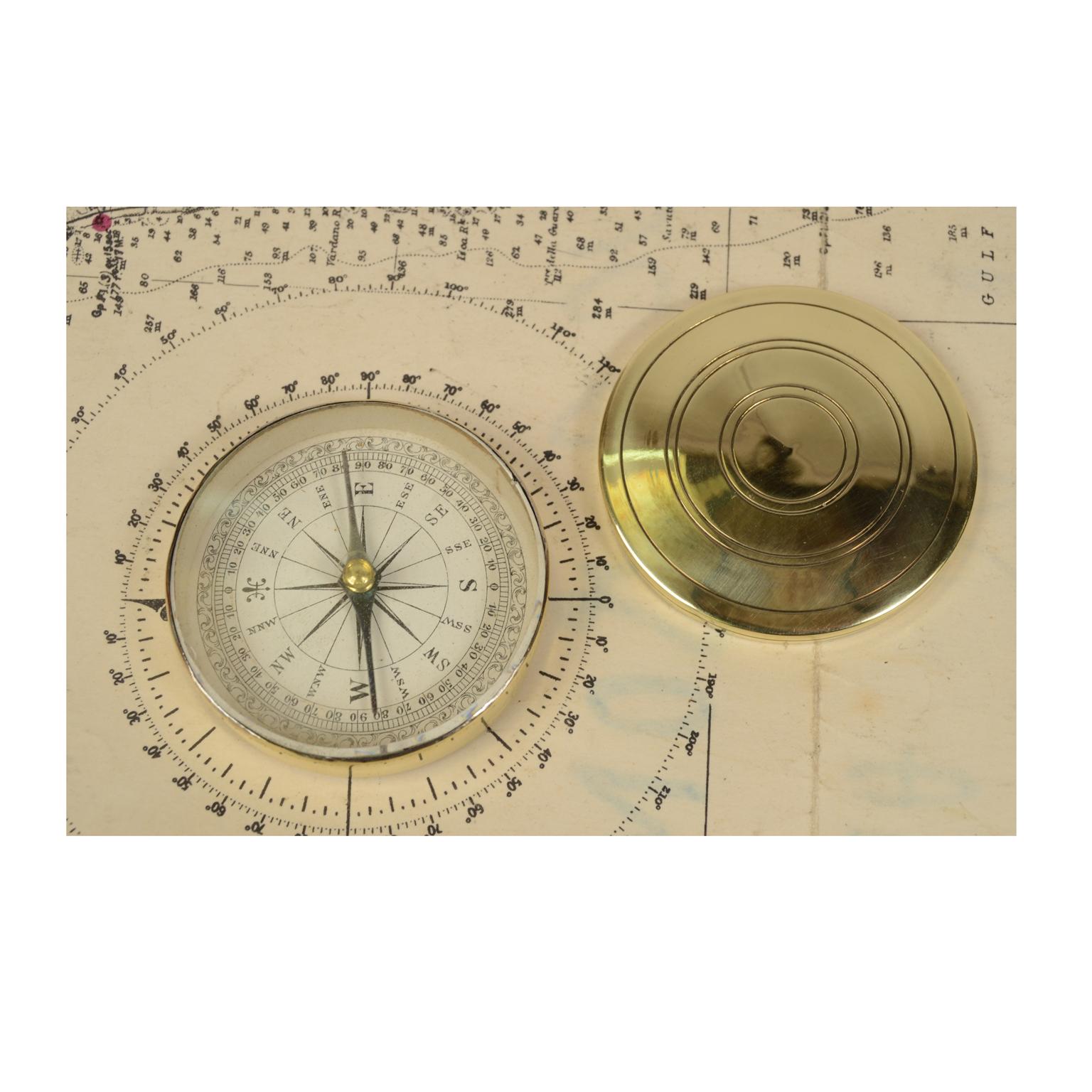 Magnetic topographer and travel compass, of turned brass, an instrument consisting of a magnetized needle free to rotate on a horizontal plane, marking the direction of magnetic north with the tip of the needle. Beautiful compass card with sixteen