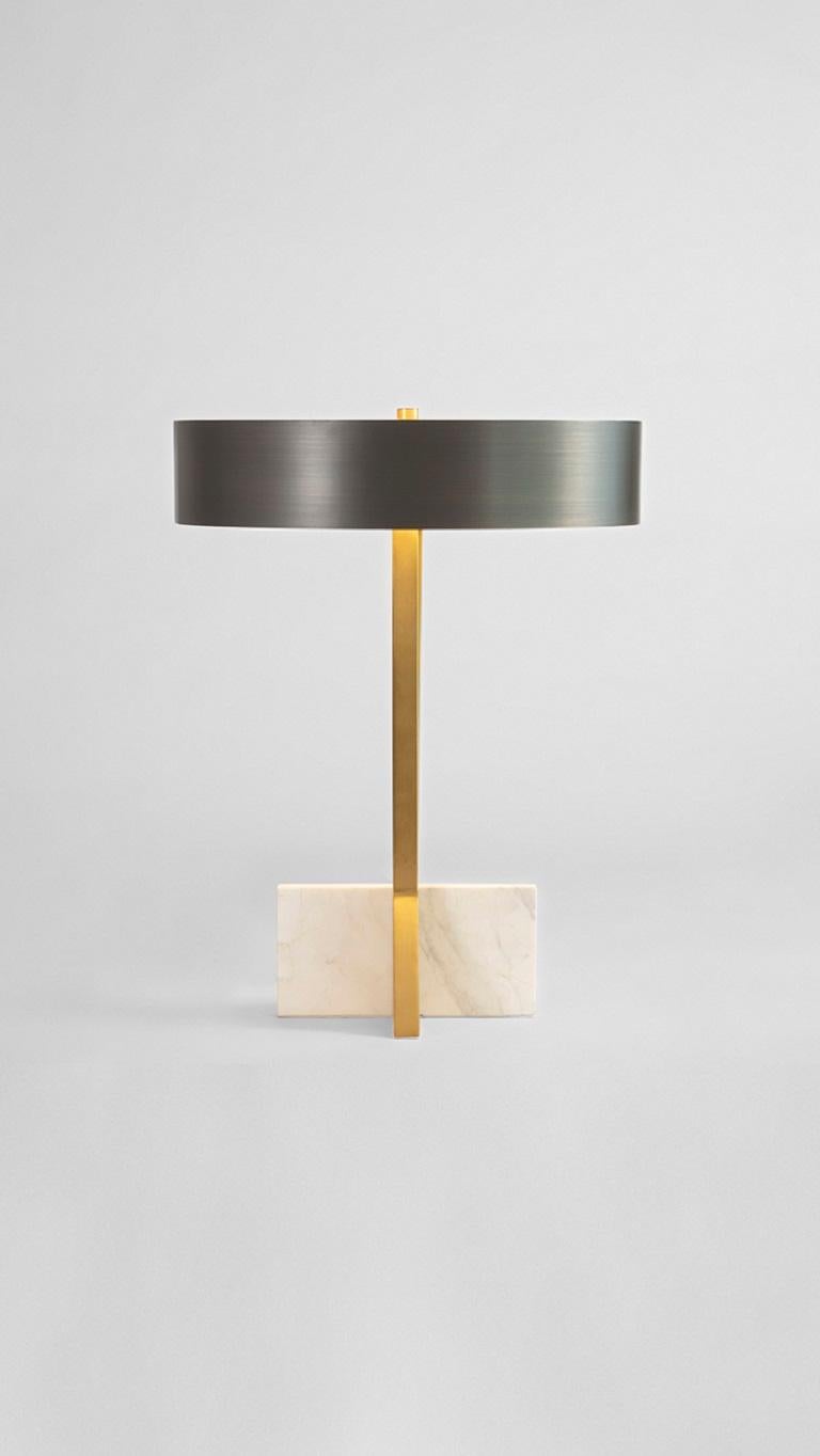 Brass Tower Table Lamp by Square in Circle
Dimensions: W 35 x D 35 x H 45 cm
Materials: Brushed brass finish, white marble, brushed grey metal, white perspex diffuser 

A profile of this light's base section was developed after spending time playing