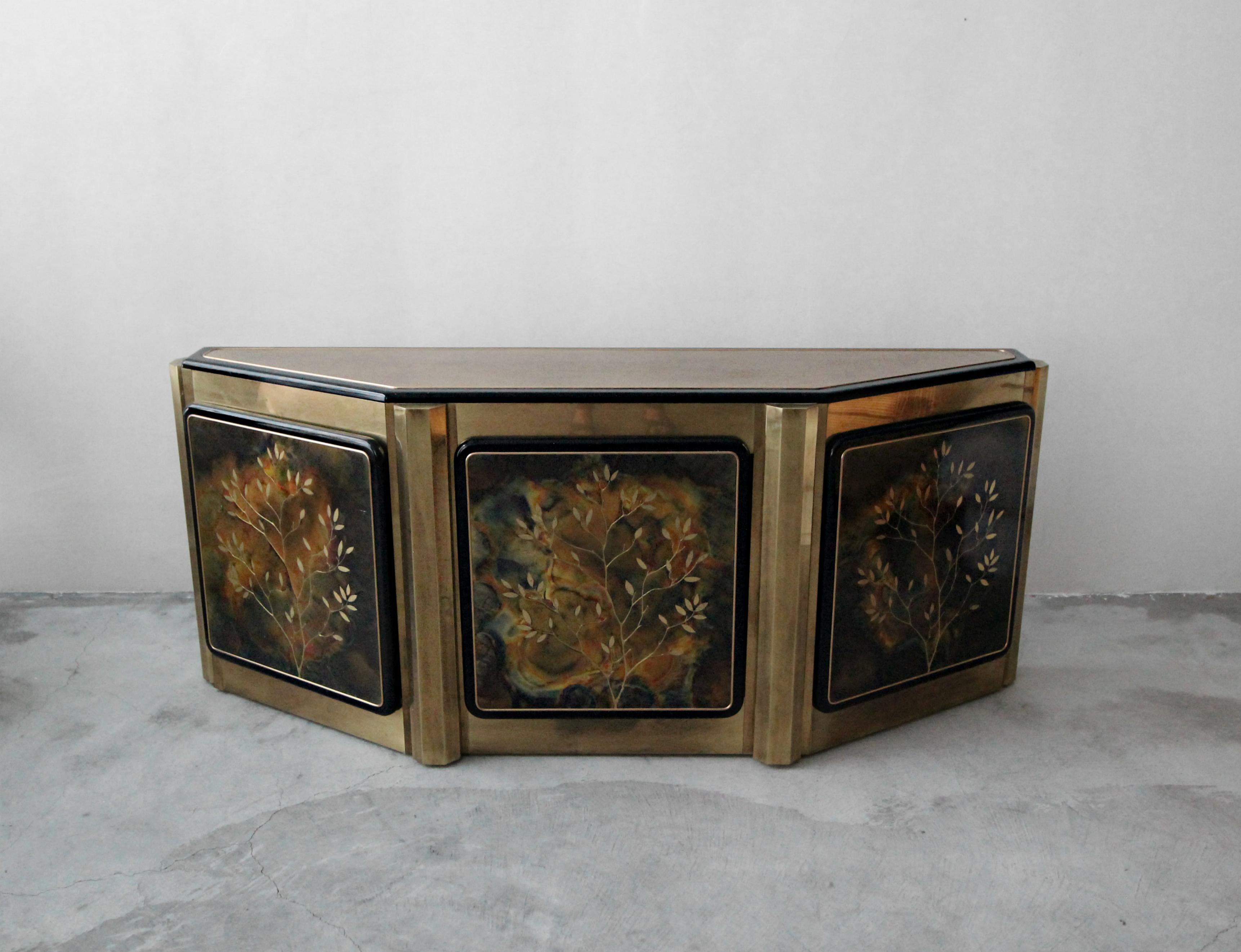 Beautiful angular brass-clad credenza by Bernhard Rohne for Mastercraft. Acid etched doors with a 