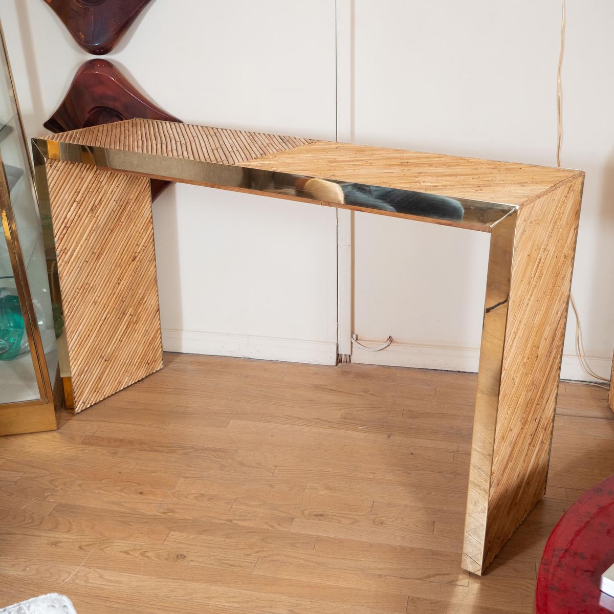 Brass trimmed bamboo waterfall console table.