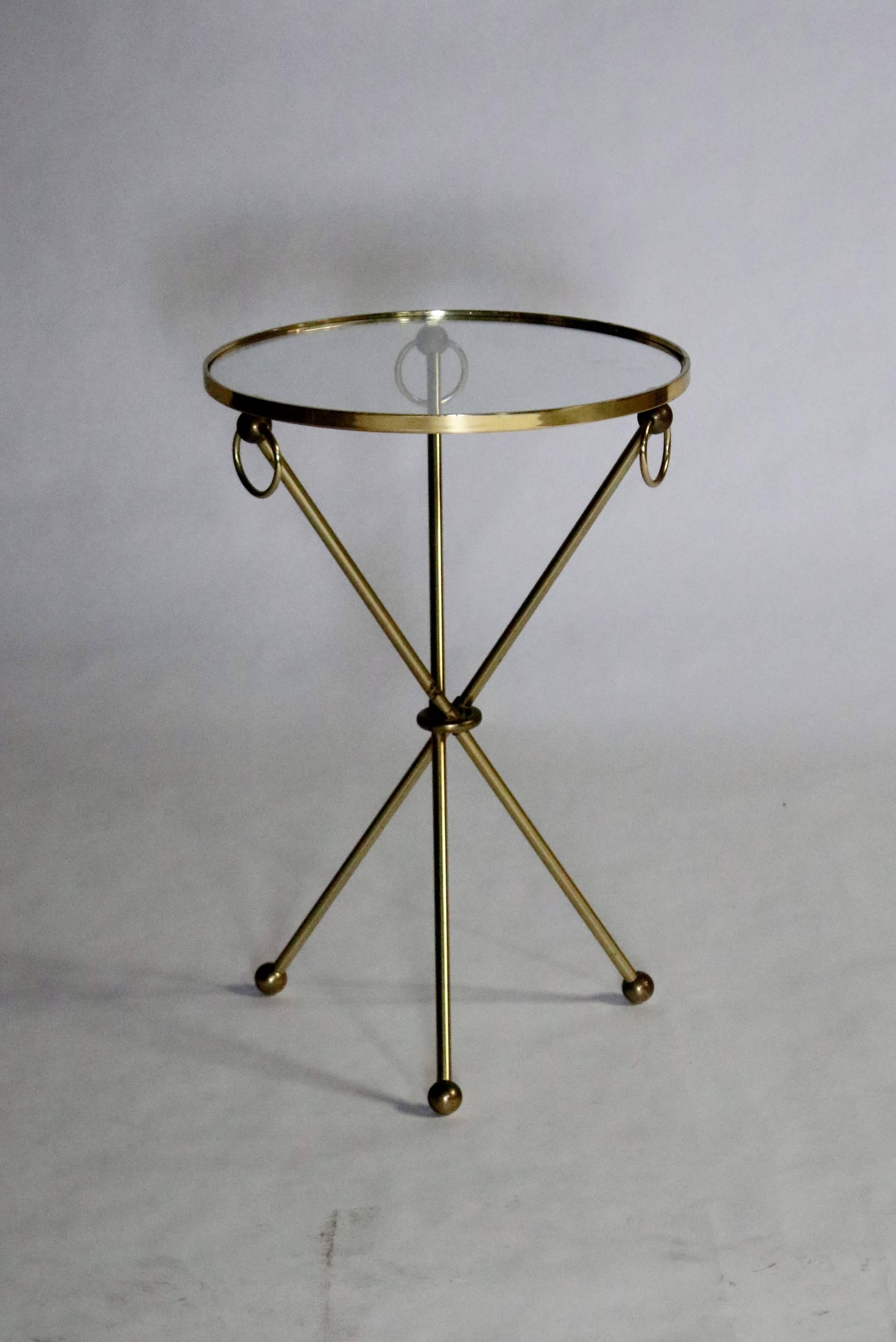 Midcentury brass tripod side table with glass inset top, loop handles and brass ball feet.